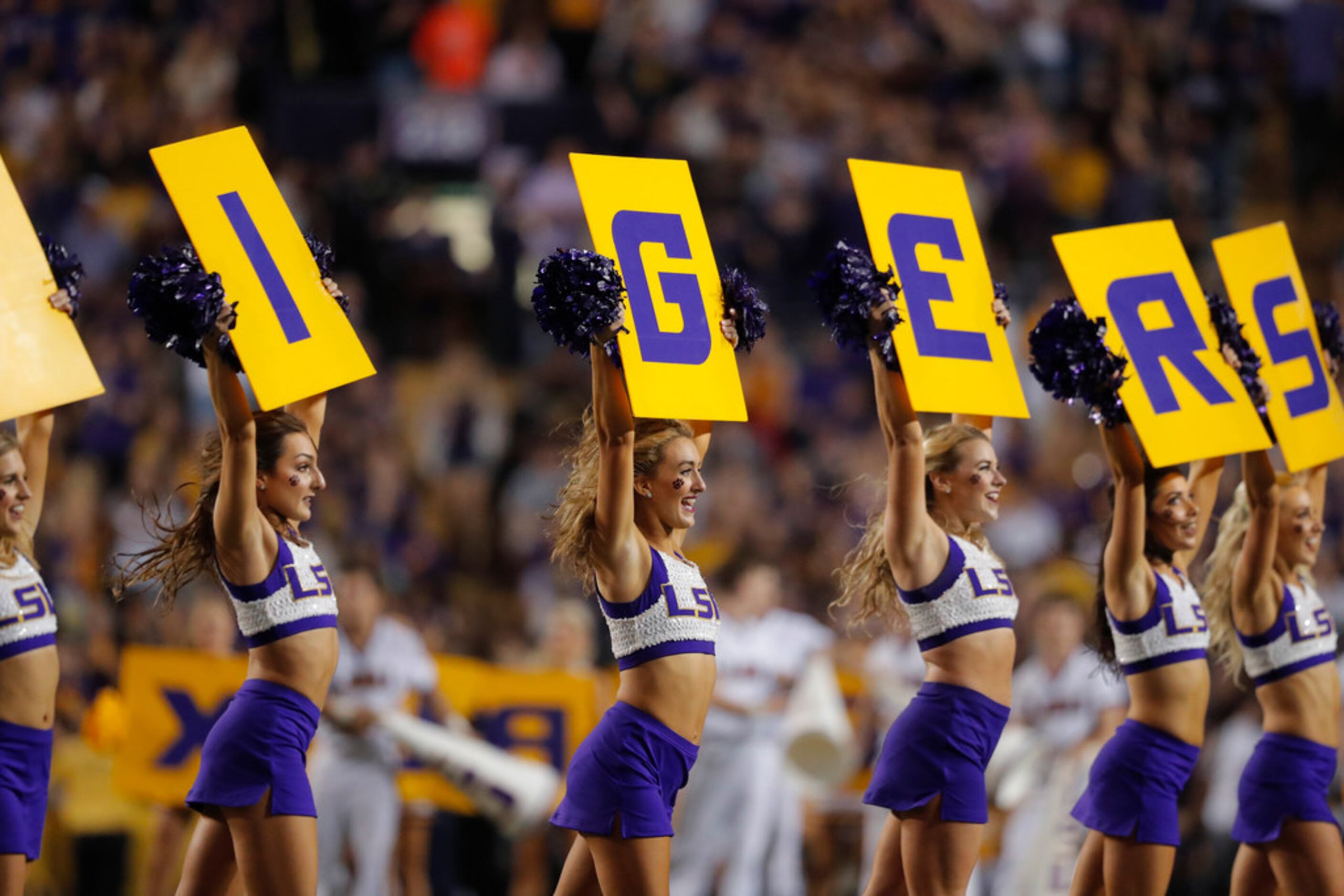 LSU cheerleaders perform in the first half of an NCAA college football game against Texas...