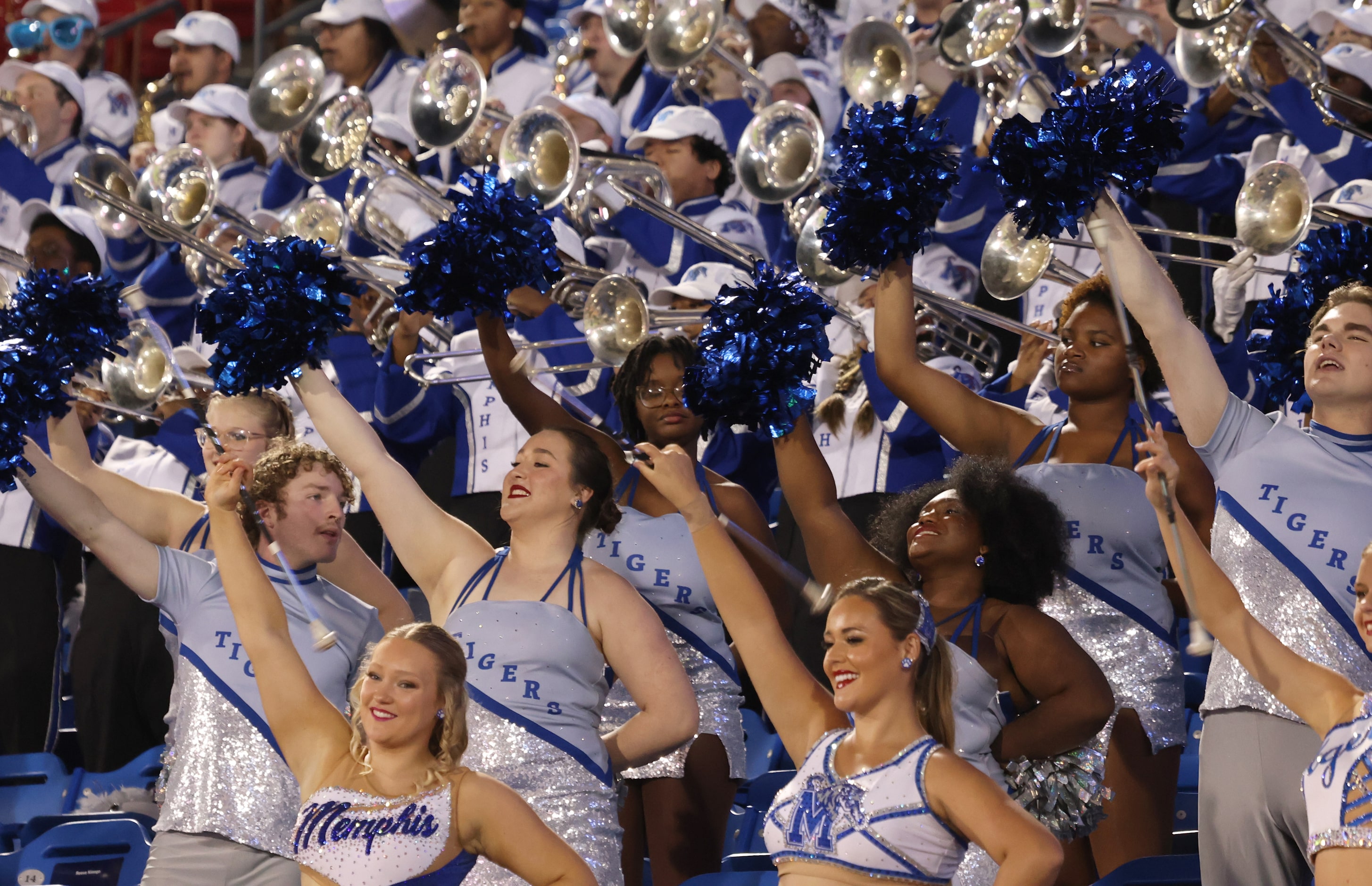 Memphis band and drill team members perform from the stands during first quarter action of...