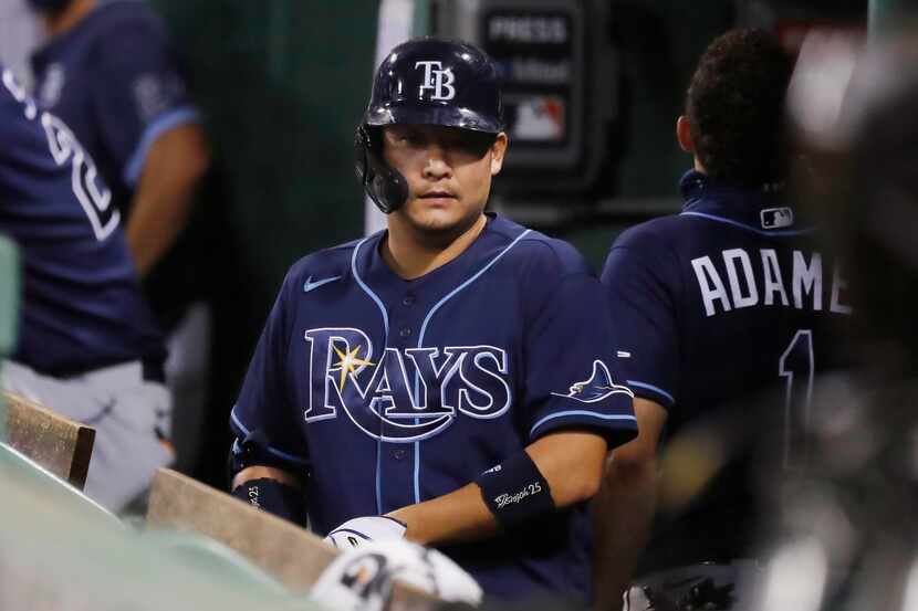 Tampa Bay Rays' Yoshitomo Tsutsugo stands in the dug out after a pop foul out while pinch...