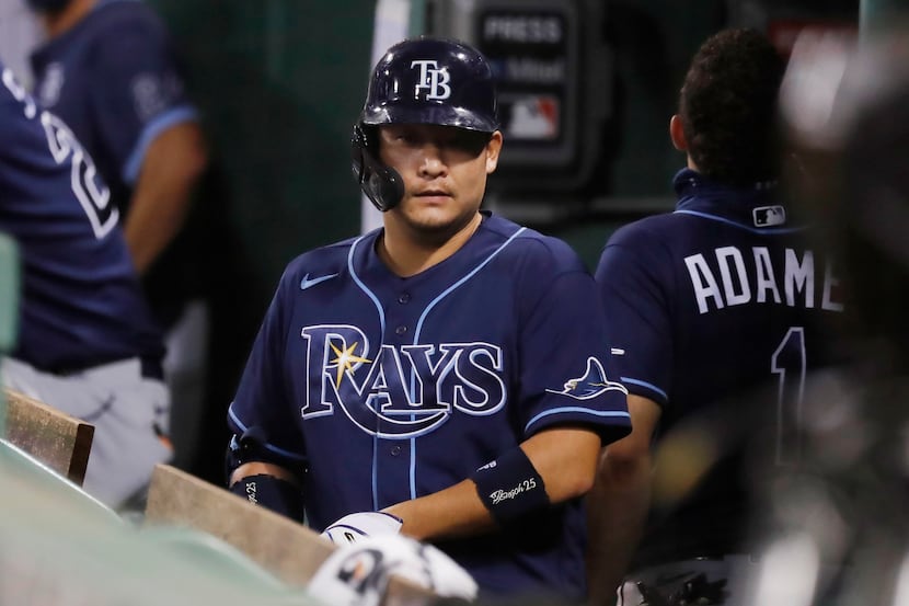 Tampa Bay Rays' Yoshitomo Tsutsugo stands in the dug out after a pop foul out while pinch...