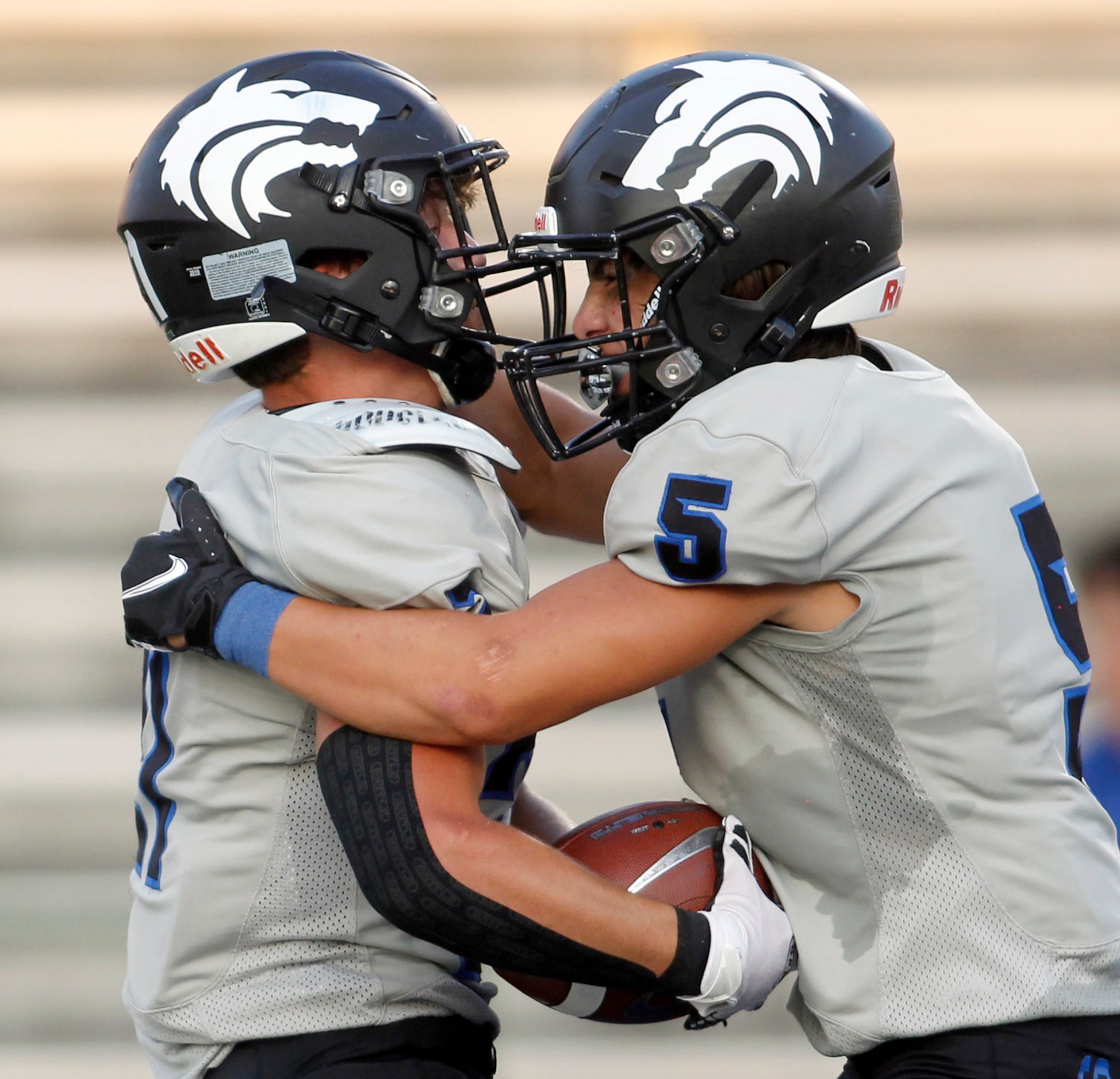 Plano West running back Dermot White (21), left, celebrates with receiver Alex Salinas (5)...