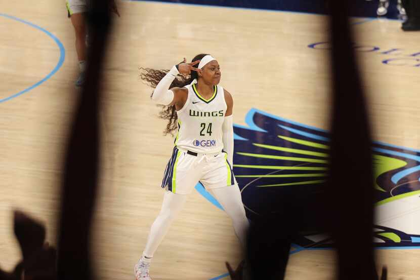 Dallas Wings guard Arike Ogunbowale reacts after scoring the game point against the Indiana...