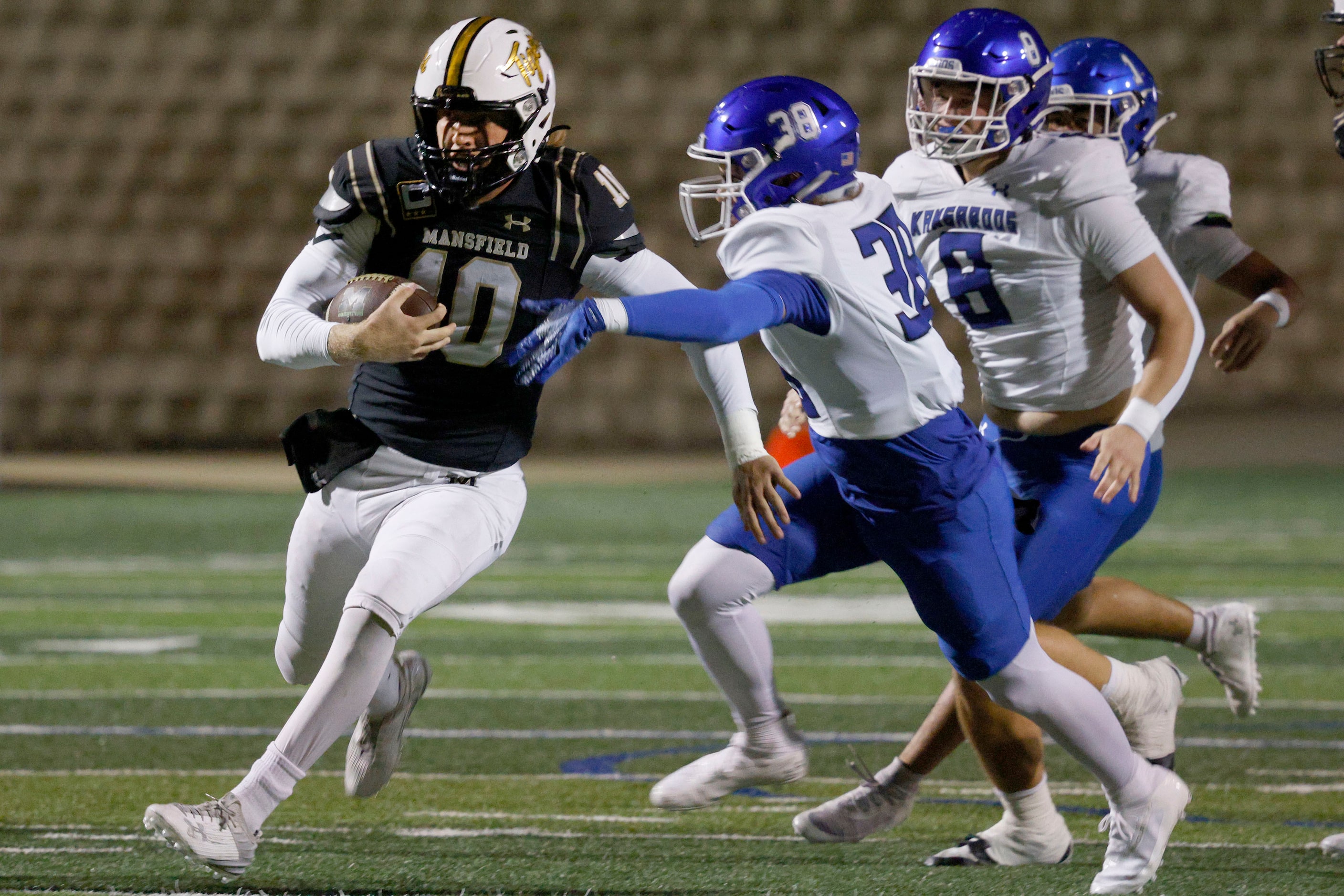 Mansfield's Braxton Van Cleave (10) carries the ball against Weatherford's Camden Collins...