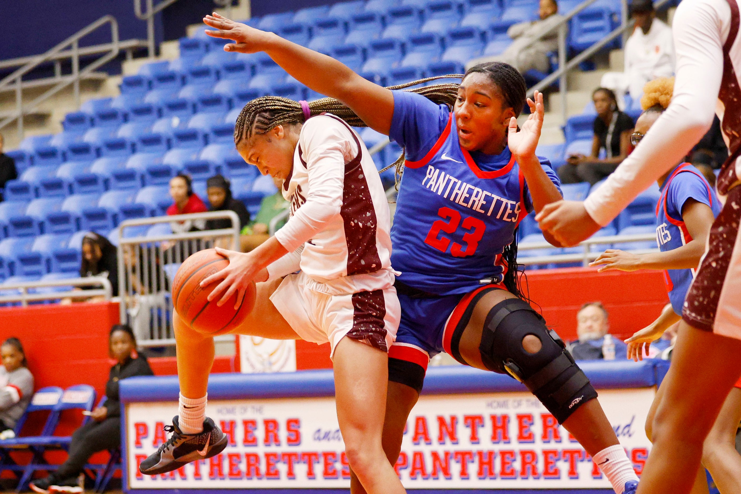 Pearland's A’Zyua Blair (2) and Duncanville's Trystan James (23) battle for a rebound during...