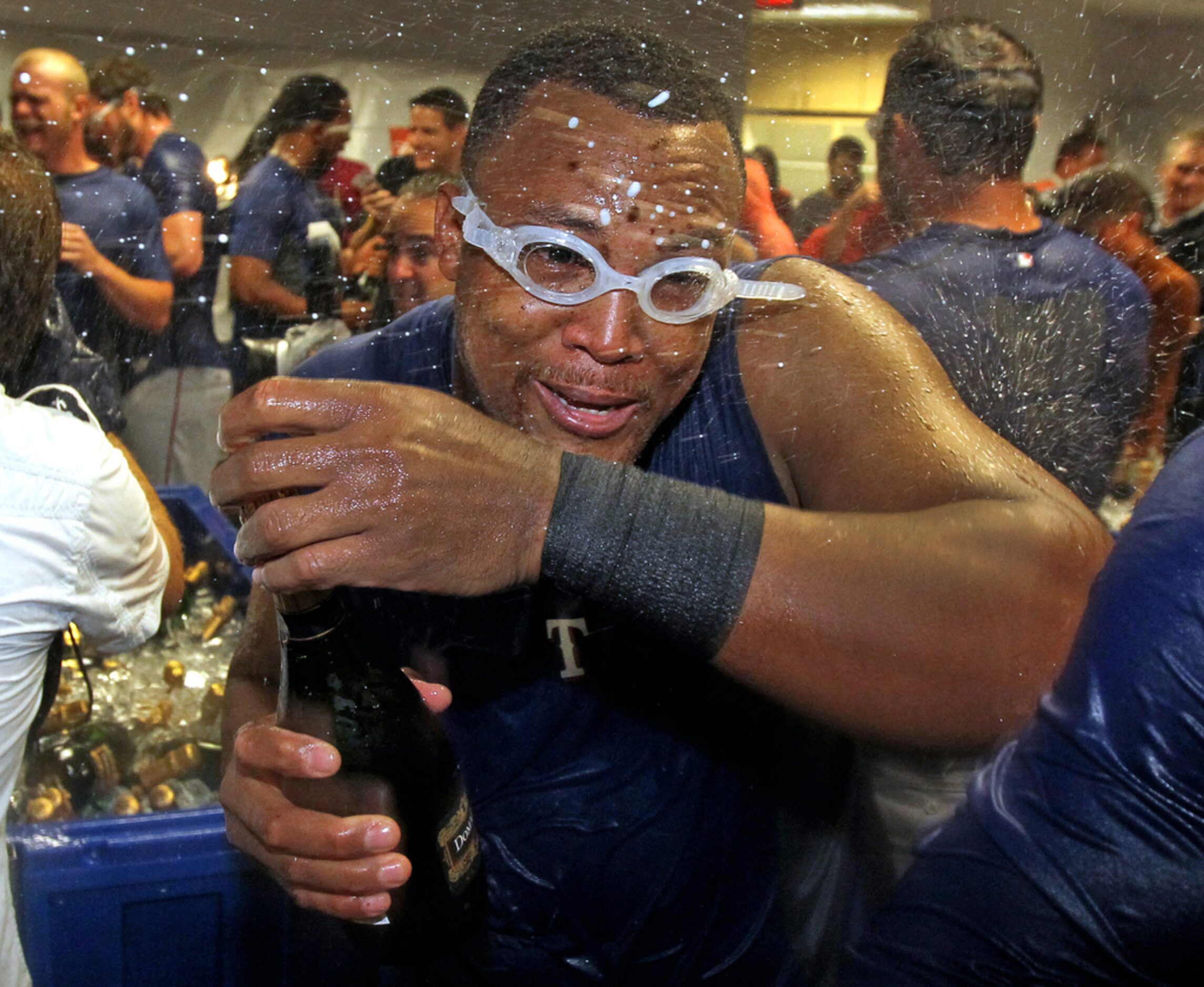 texas 3B Adrian Beltre celebrates with teammates in the locker room after Game 4 of the...