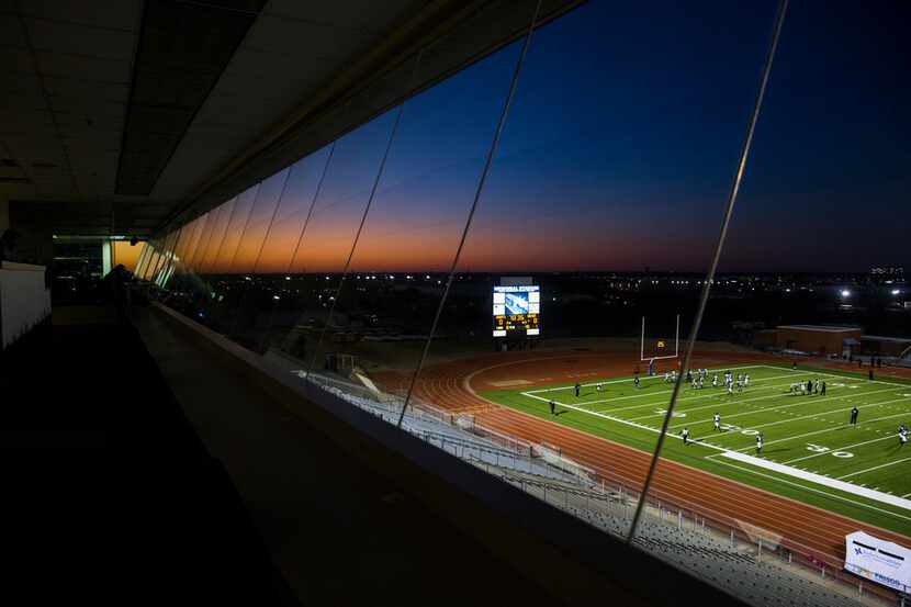 Mansfield Timberview football players can be seen from the press box as they warm up before...