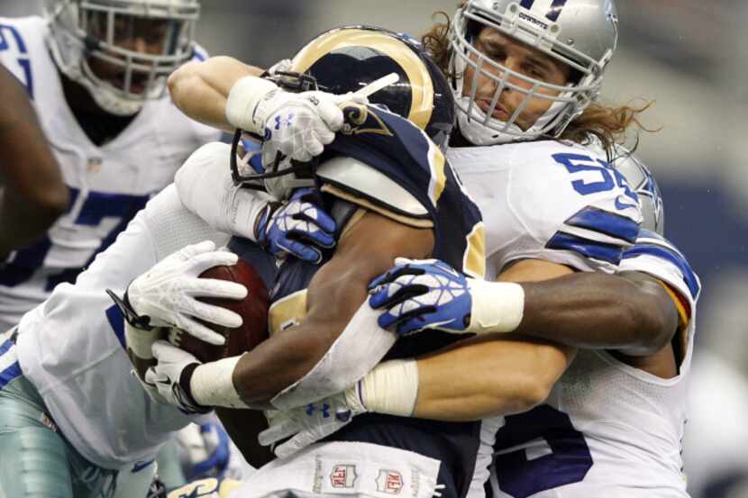 St. Louis Rams running back Benny Cunningham (36) is brought down by Dallas Cowboys...