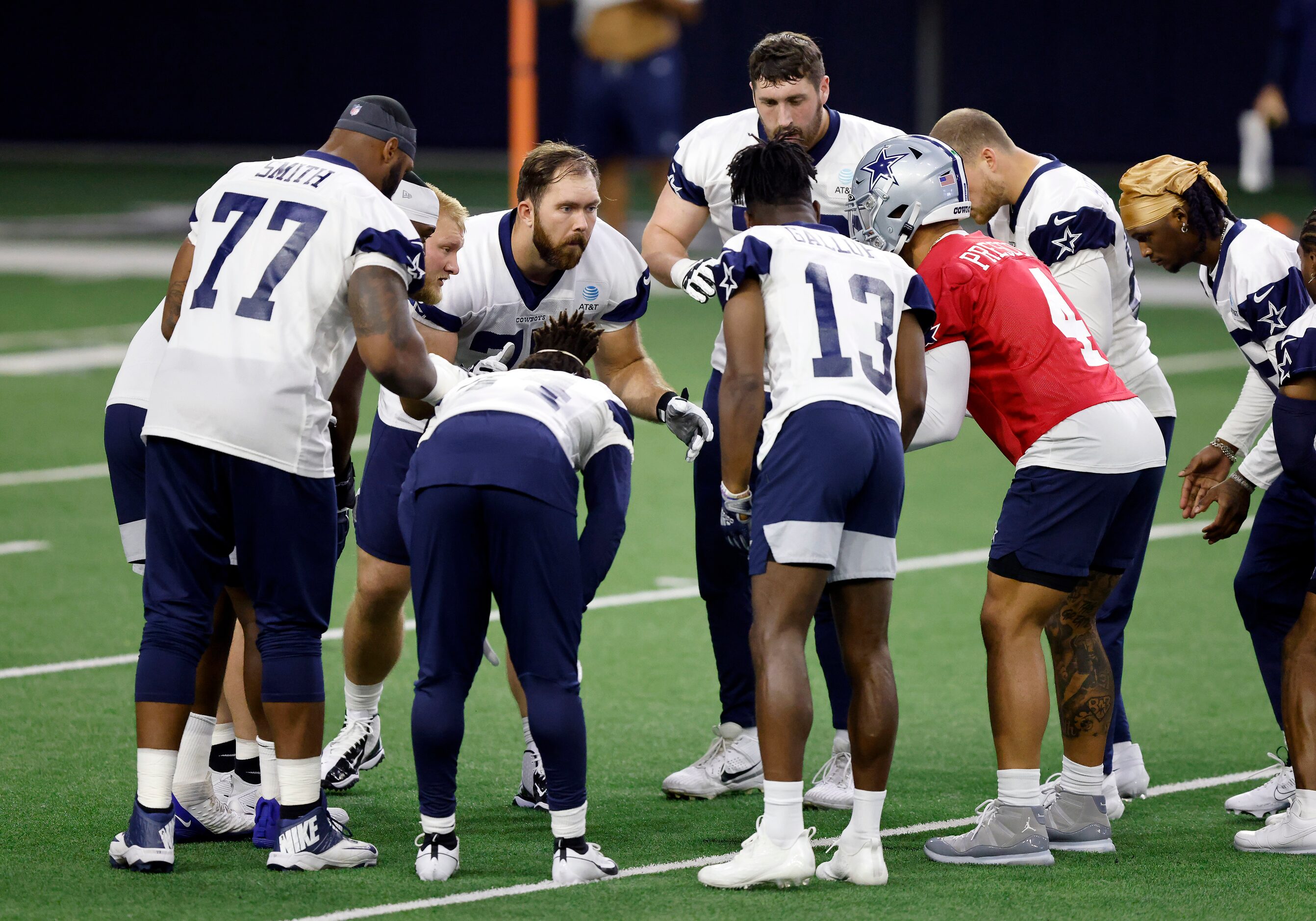 The Dallas Cowboys offensive line, including offensive tackle Tyron Smith (77), center Tyler...