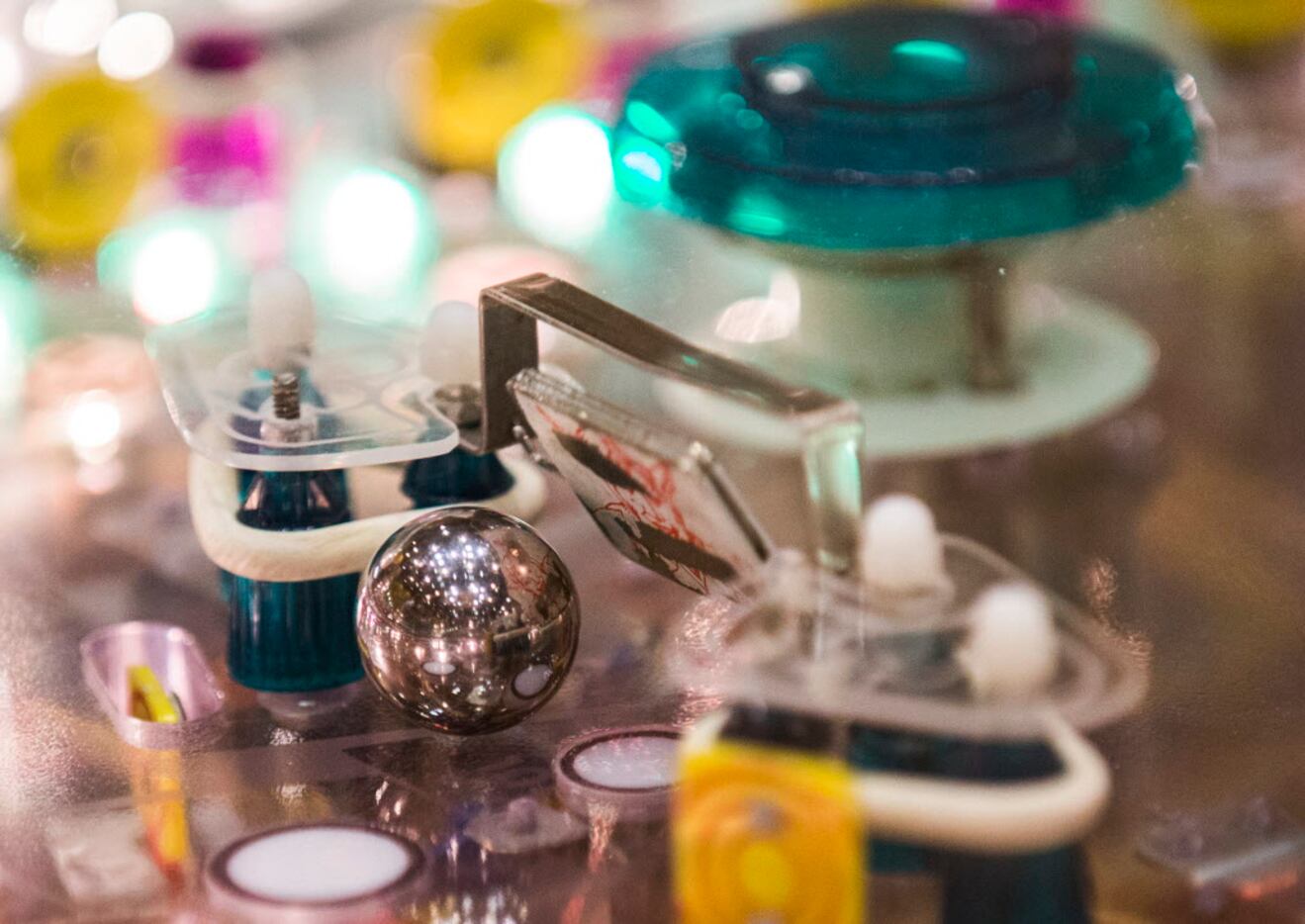A ball makes it's way through a machine during the 2015 Texas Pinball Festival on Saturday,...
