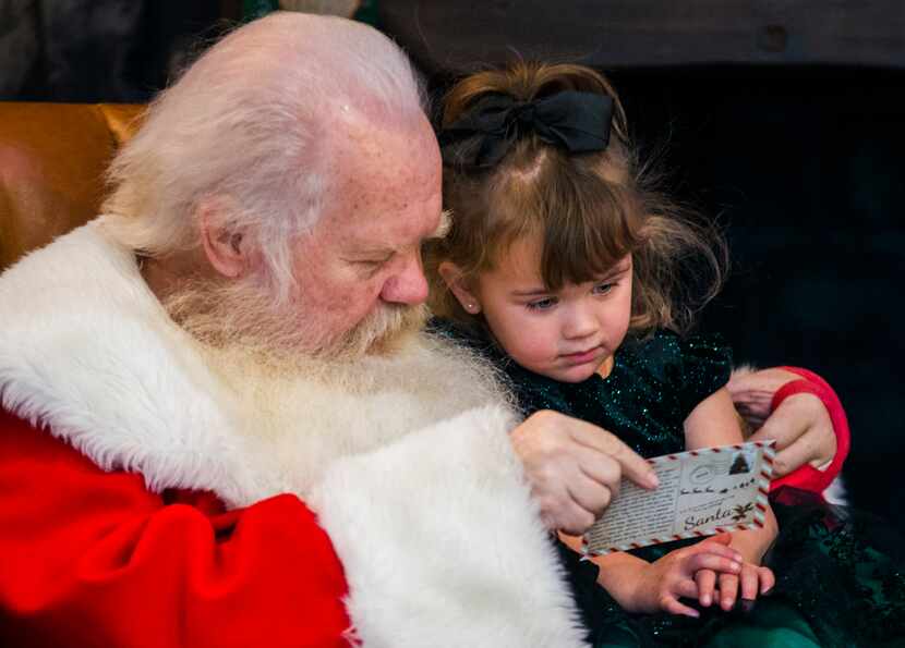 Santa Claus sat with 4-year-old Cami Johnson at NorthPark Center in 2019. 