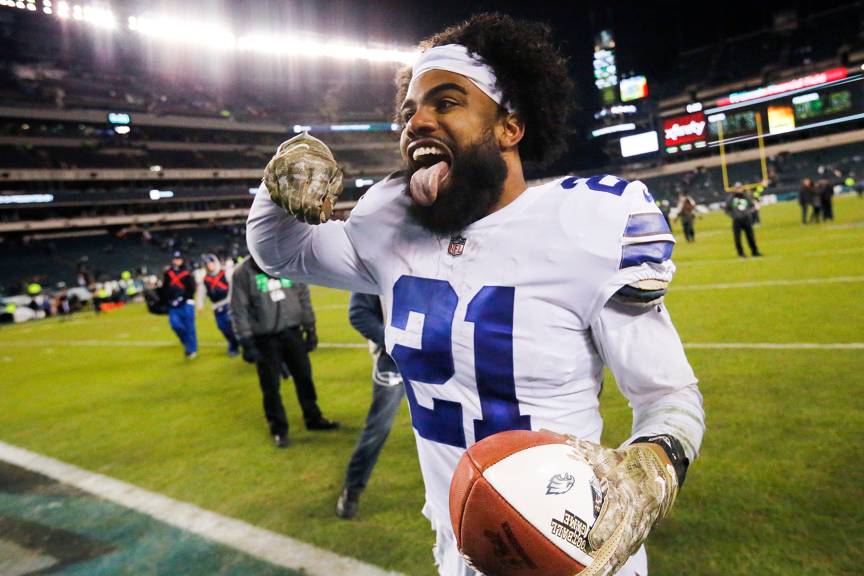 With the NBC game ball in hand, Dallas Cowboys running back Ezekiel Elliott (21) celebrates...