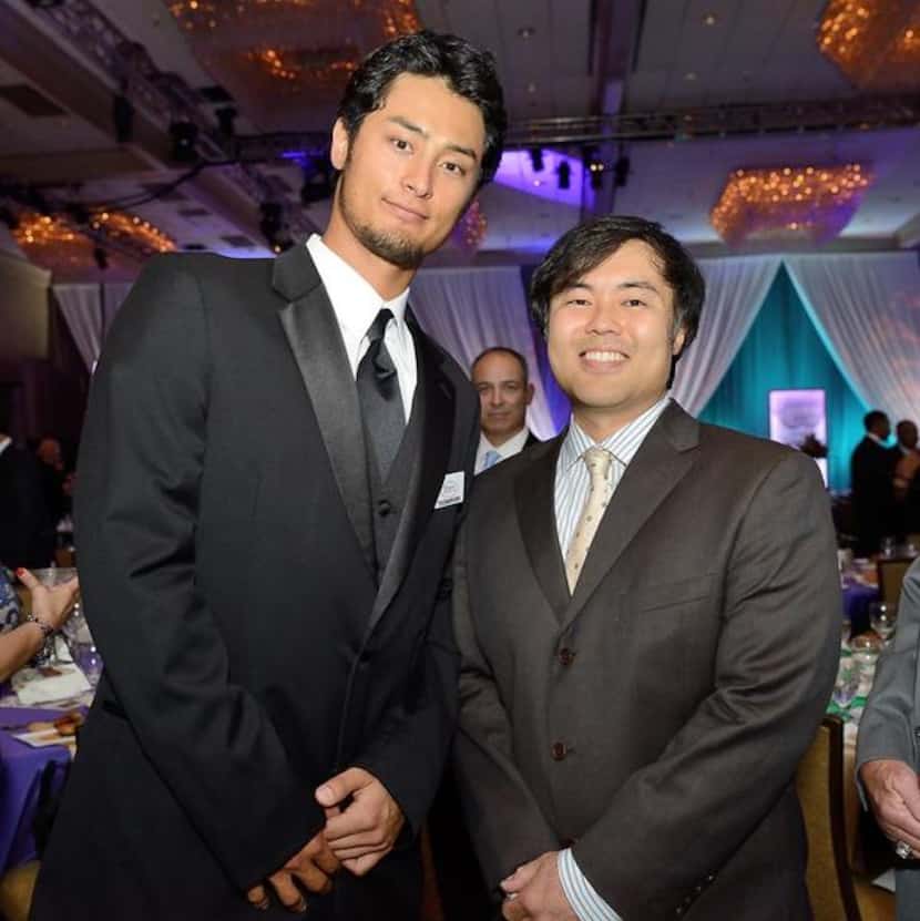 
Tak Fujita of Irving, right, with Texas Rangers pitcher Yu Darvish at the Texas Rangers...