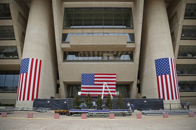 Forty-foot American flags are draped from Dallas City Hall for Monday's Veterans Day Parade,...