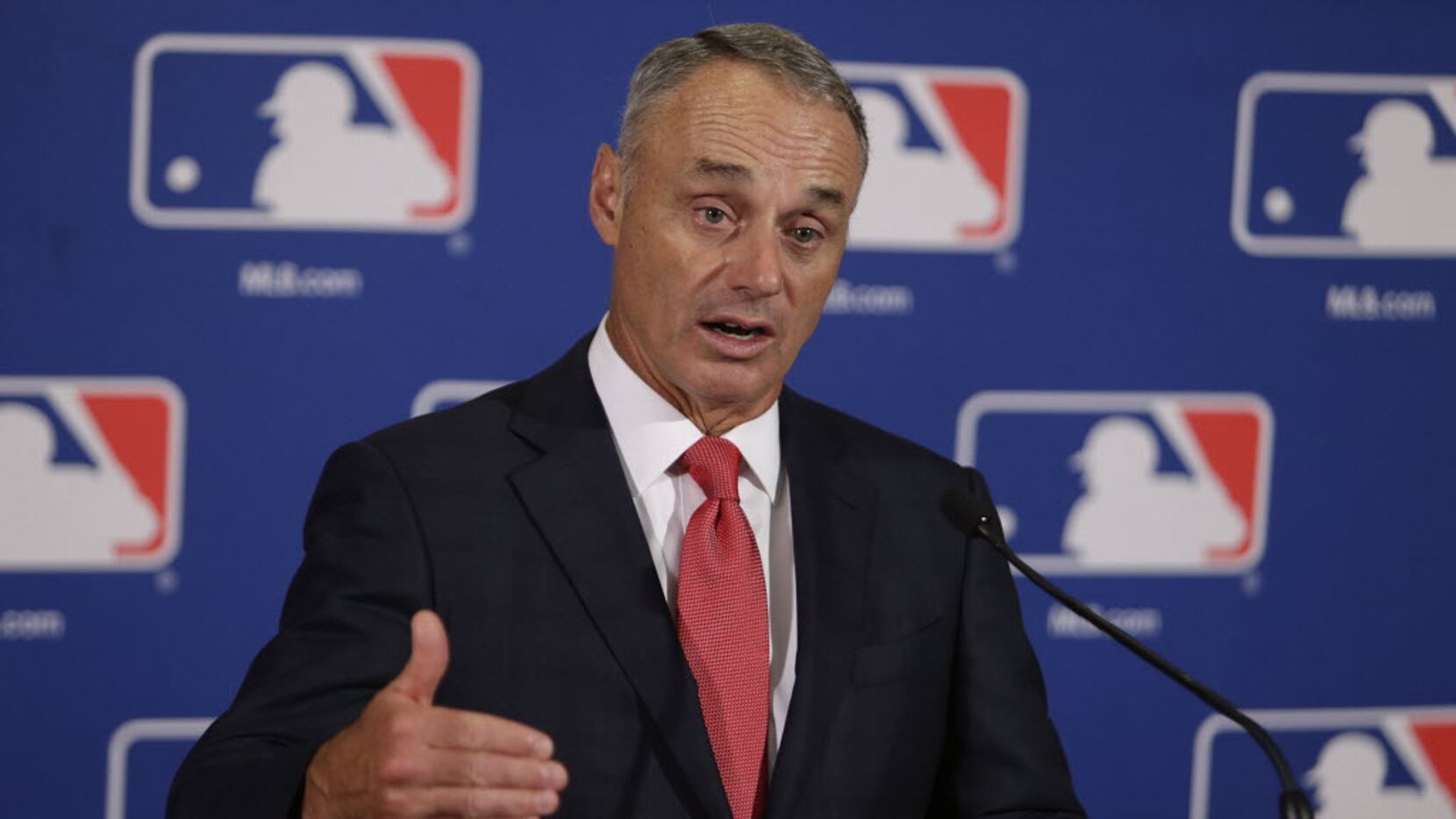 Major League Baseball commissioner Rob Manfred speaks to reporters following morning...