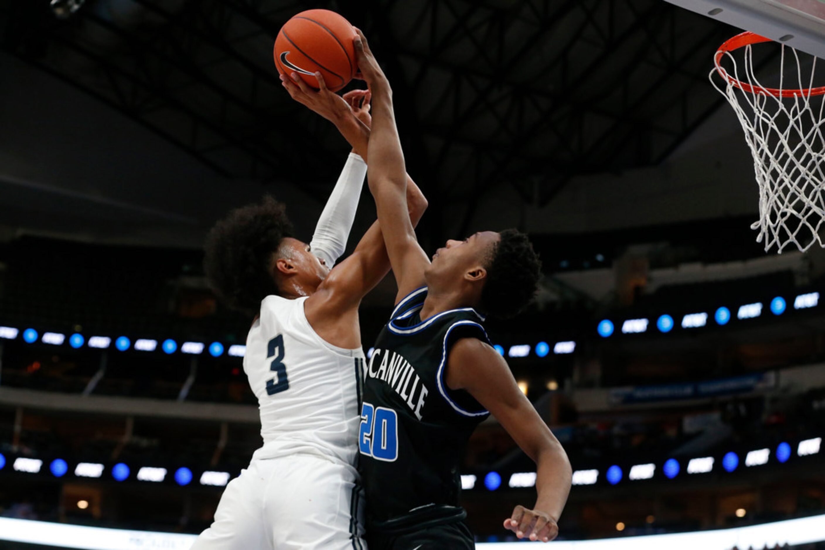 Sierra Canyon's Brandon Boston Jr.  (3) has a shot blocked by Duncanville's 
Ronald Holland...