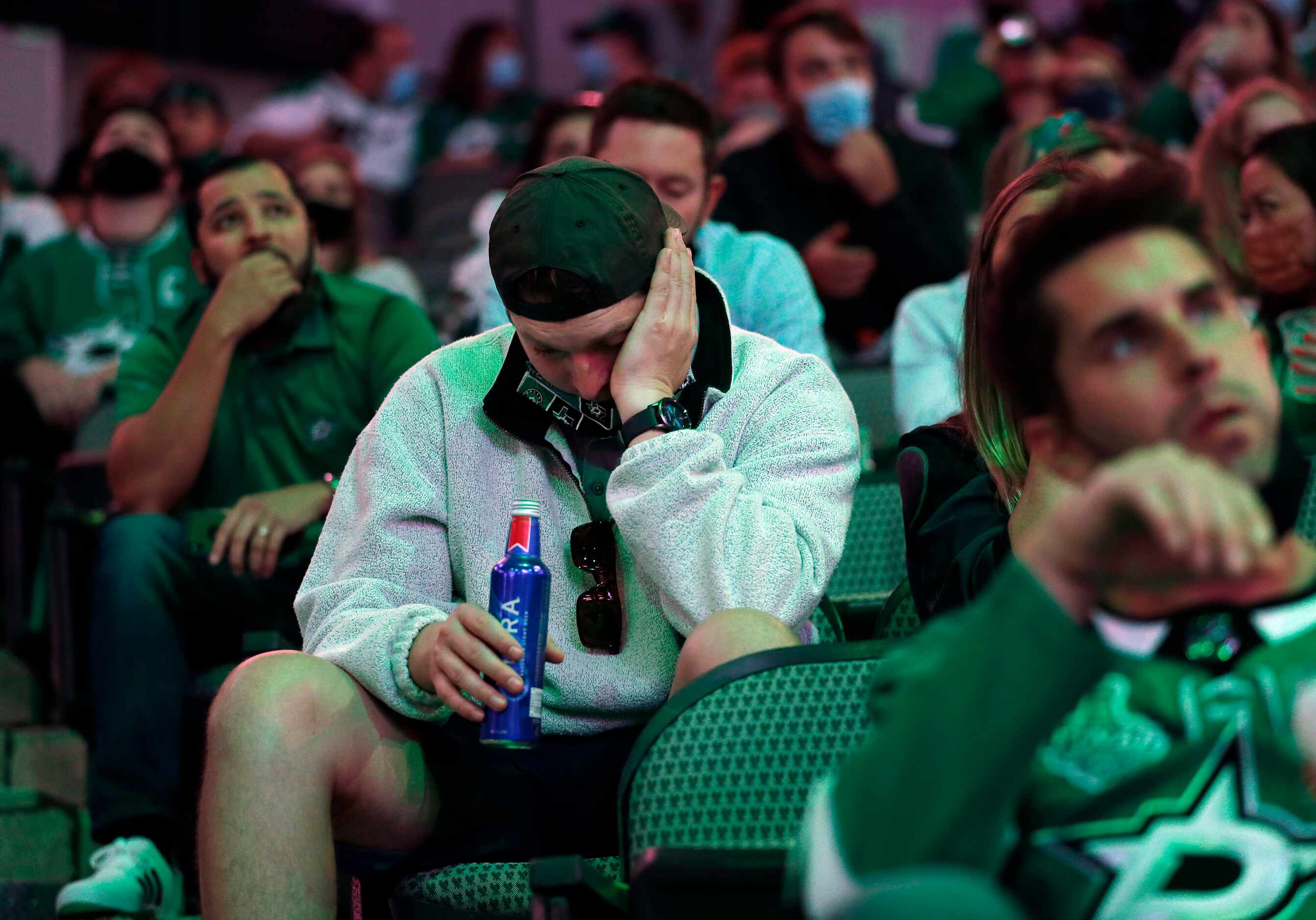 Dallas Stars fan Graylan Douglas of Plano reacts after Tampa Bay scores a third period goal...