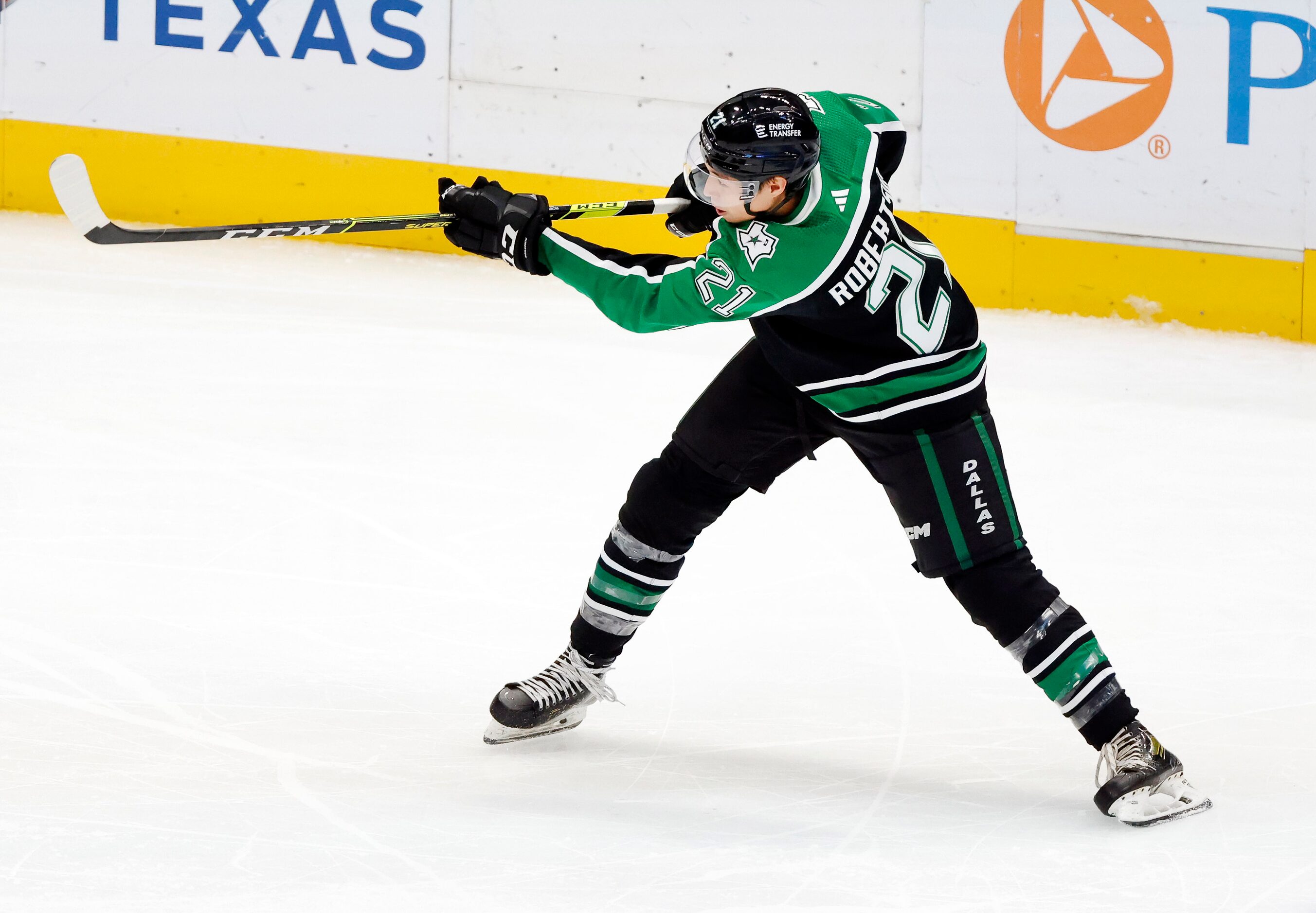 Dallas Stars left wing Jason Robertson (21) takes a shot against the Anaheim Ducks during...