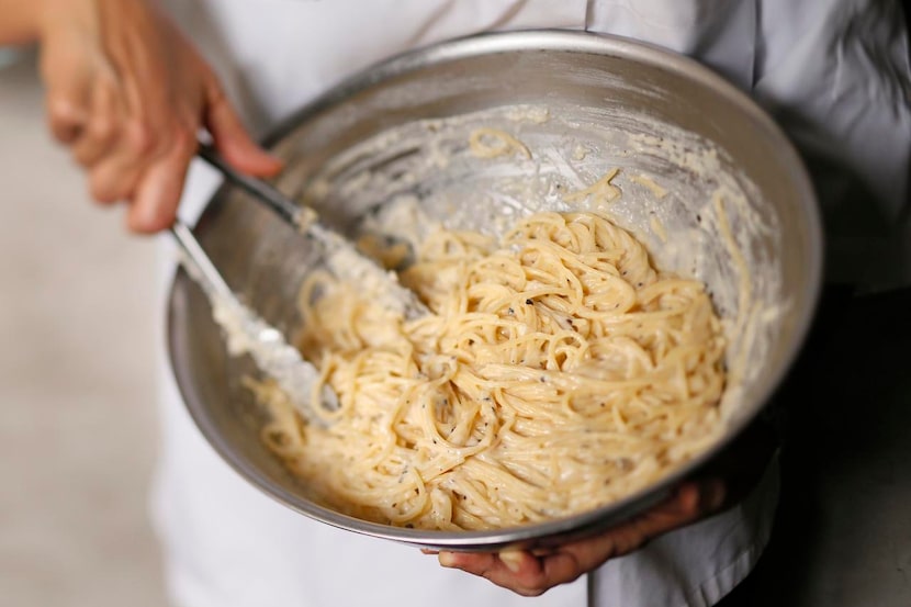 
The starchy cooking water and constant stirring are what help give Cacio e Pepe its silky...