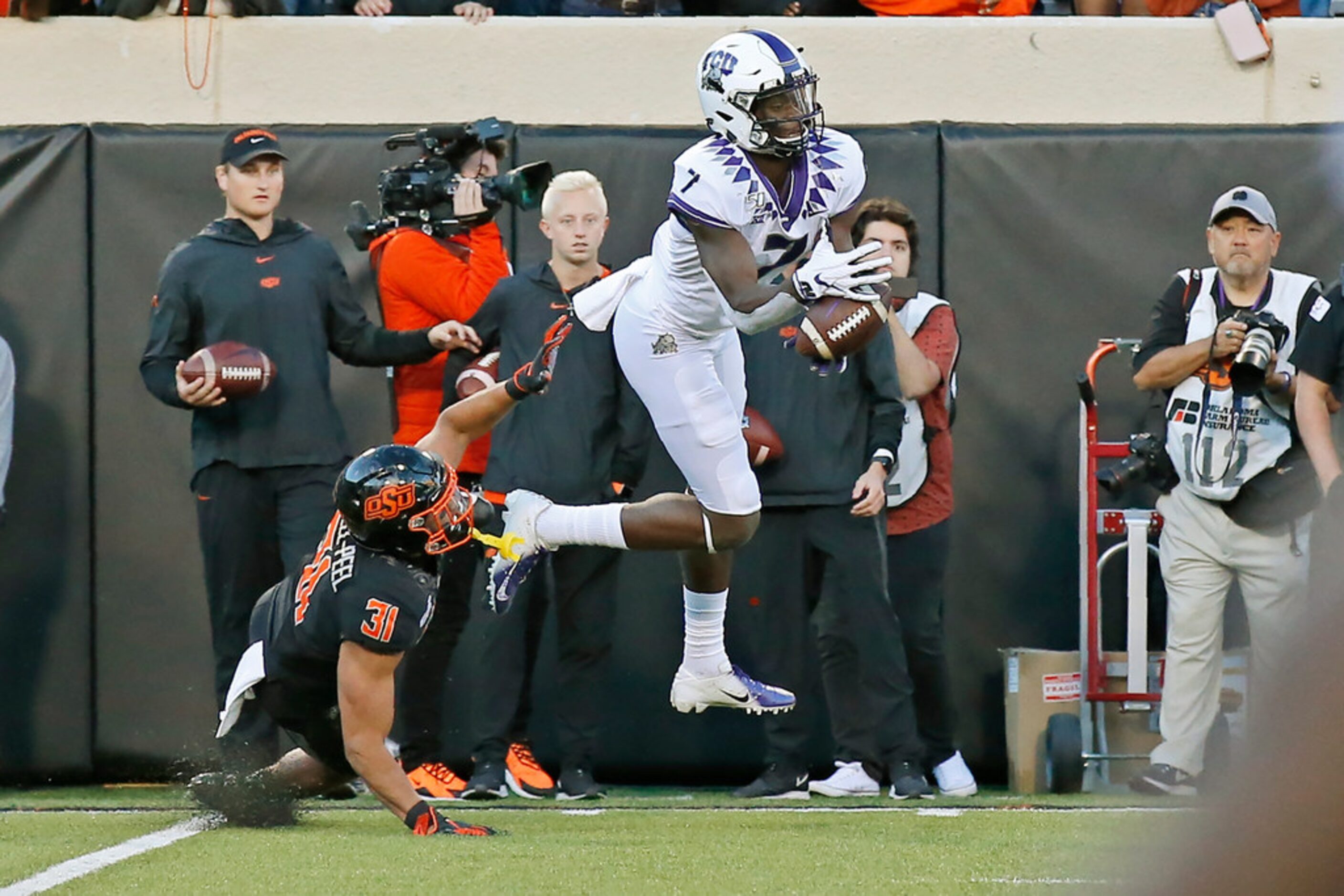 TCU wide receiver John Stephens Jr. (7) can't hold onto a pass in front of Oklahoma State...