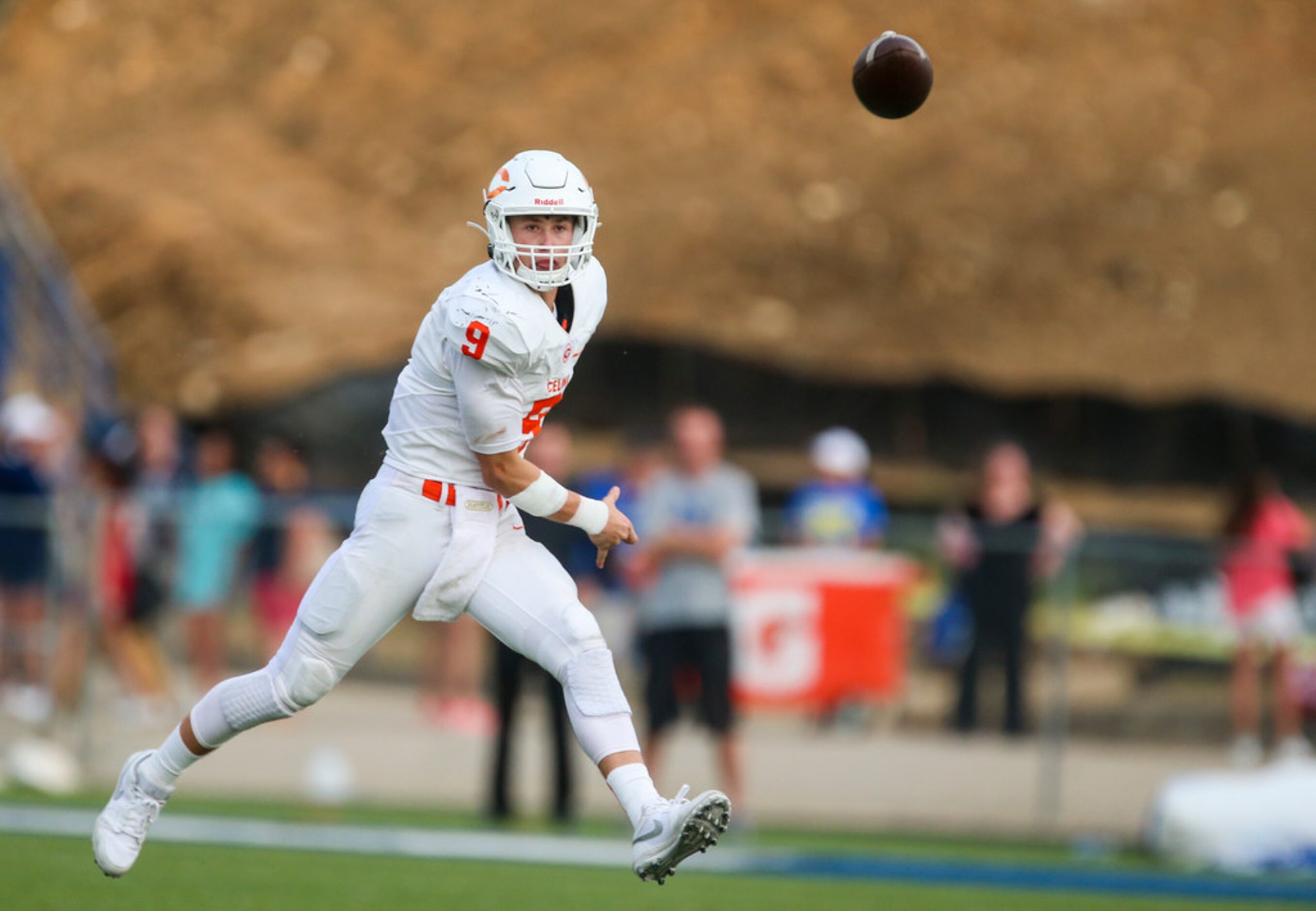 Celina quarterback Hunter Watson (9) makes a pass during a high schools football game at...