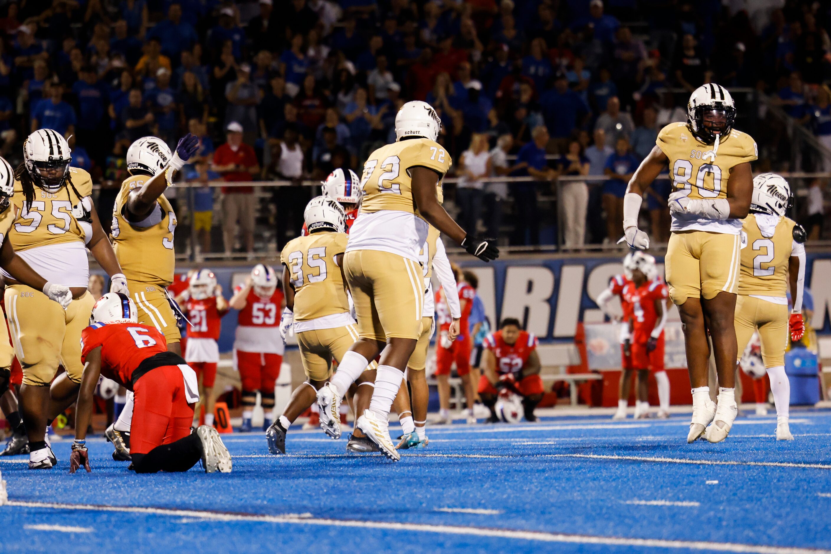 Players celebrate South Oak Cliff’s kicker Diego Varela last minute field goal for a win...