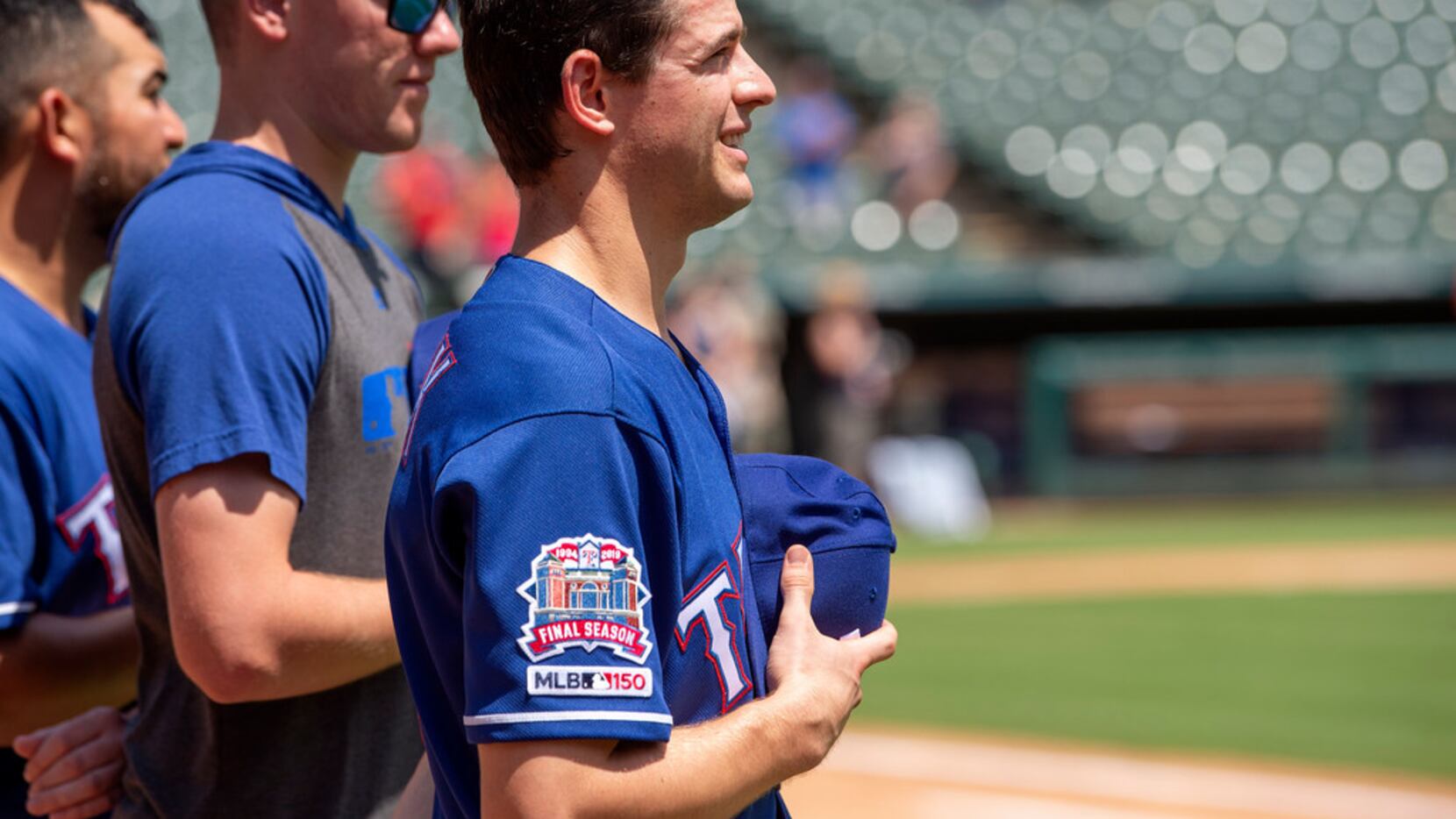Texas Rangers' Nick Solak, in his major league debut, stands on the field for the playing of...