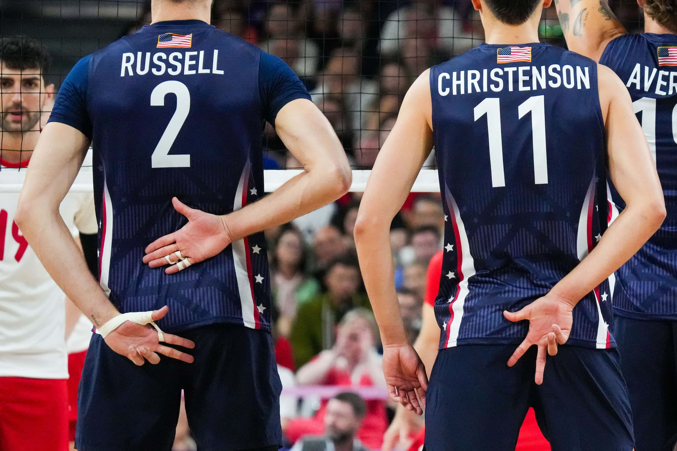 Aaron Russell (2) and Micah Christenson (11) of the United States signal a play during a...