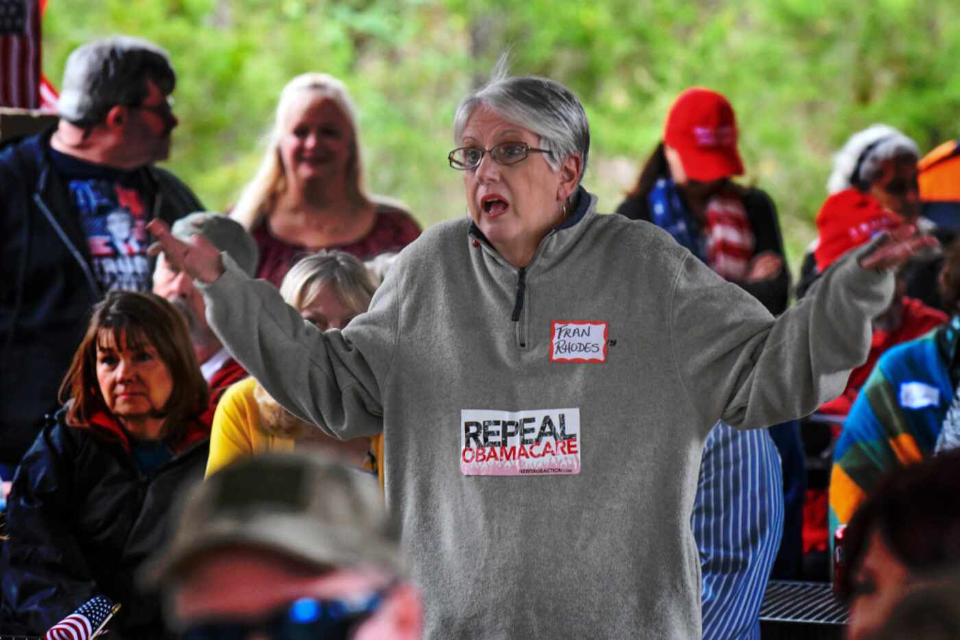 Fran Rhodes asks talk show host Chris Salcedo a question about Obamacare at a rally in...