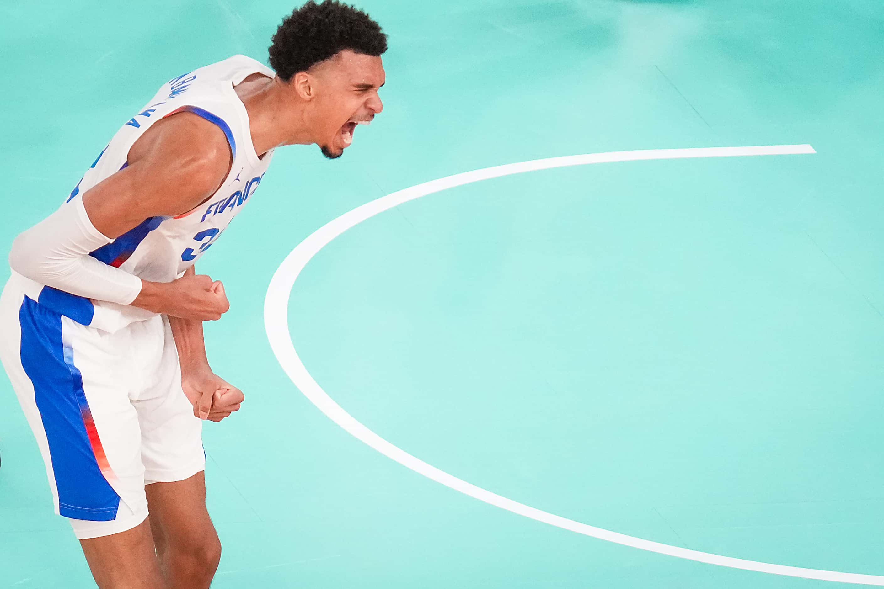 Victor Wembanyama (32) of France celebrates after a basket during a men’s basketball...