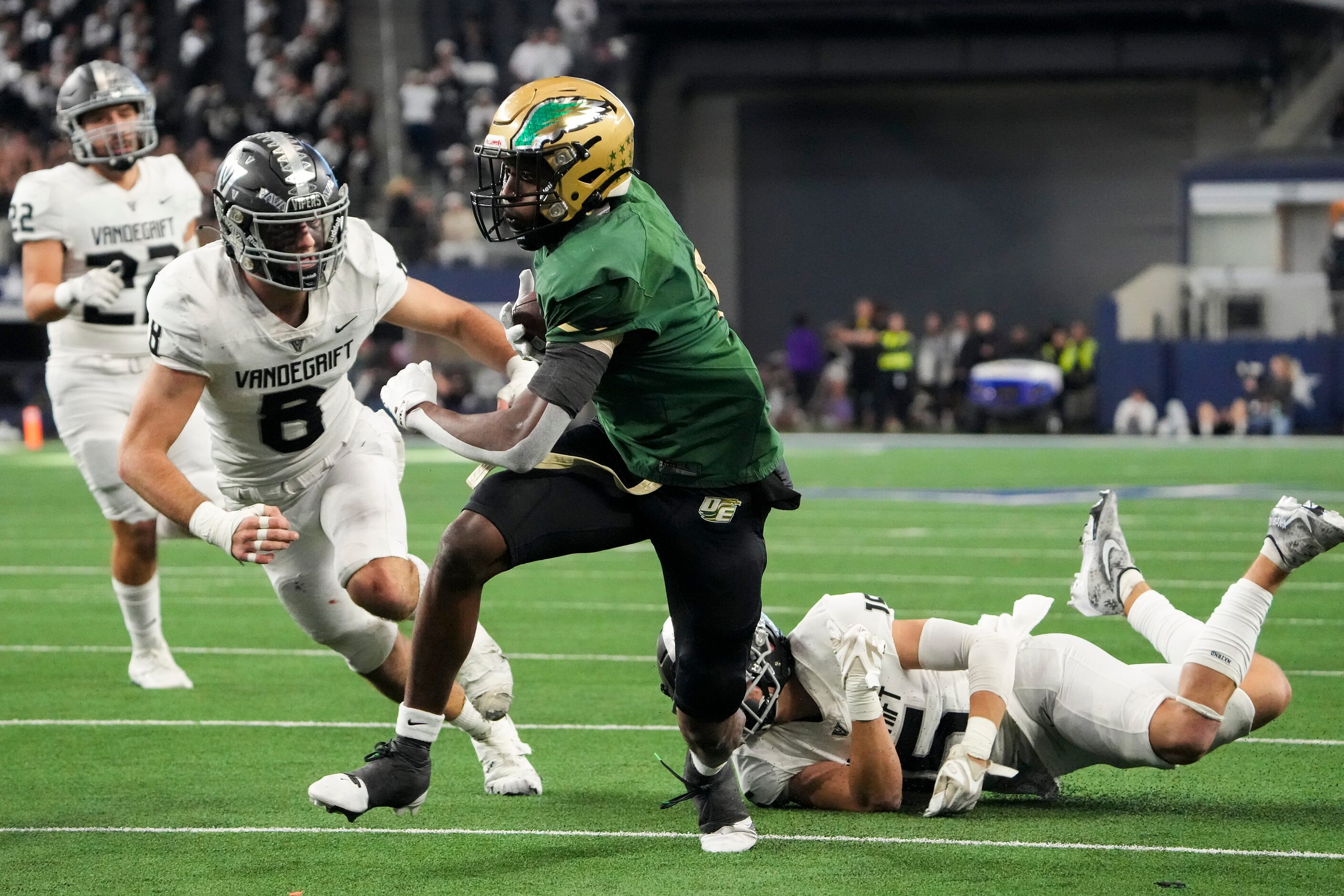 DeSoto running back Tre Wisner (5) gets past Austin Vandegrift defensive back Alex Foster...