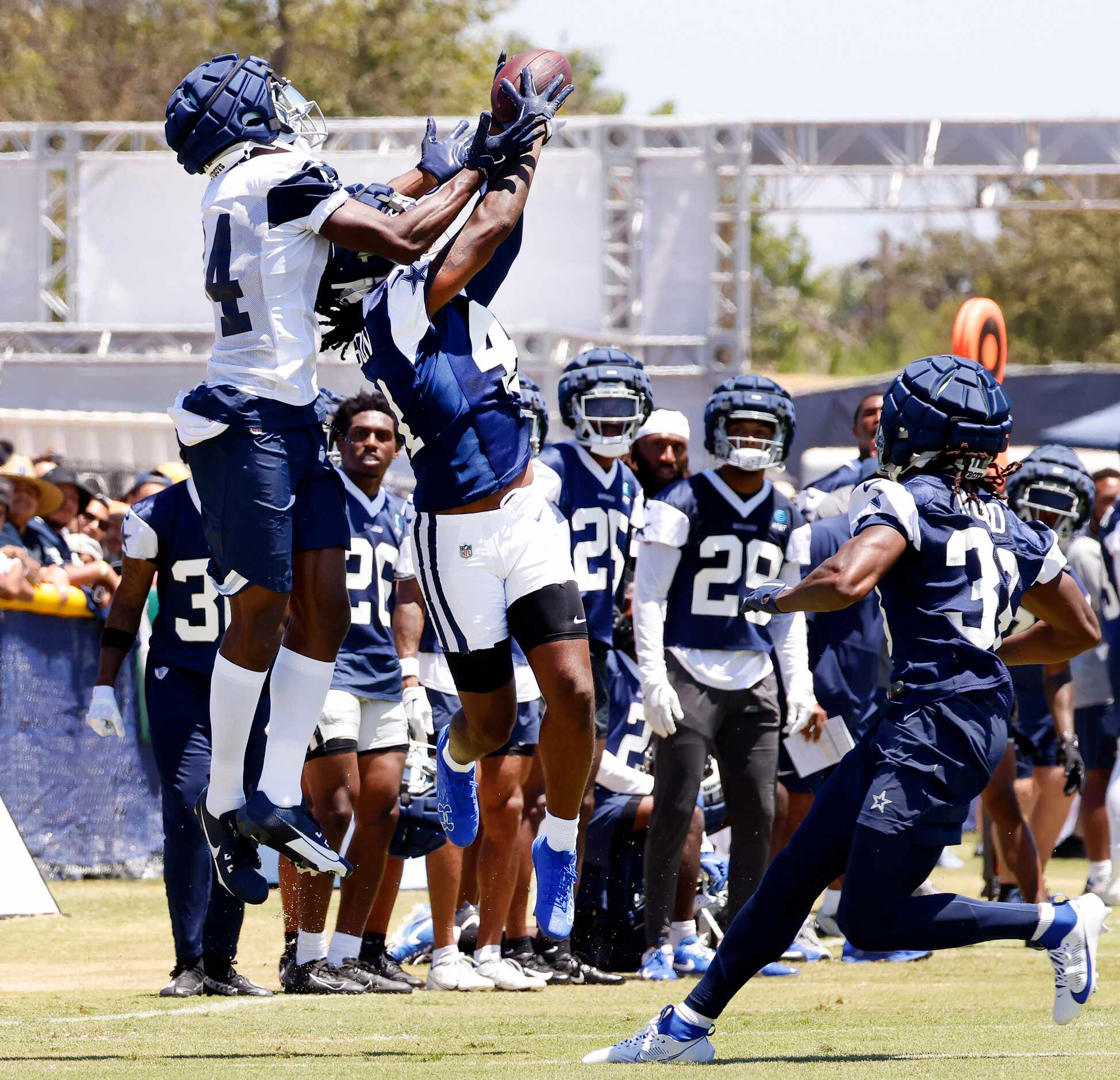 Dallas Cowboys cornerback Caelen Carson (41, right) goes up and intercepts a pass intended...