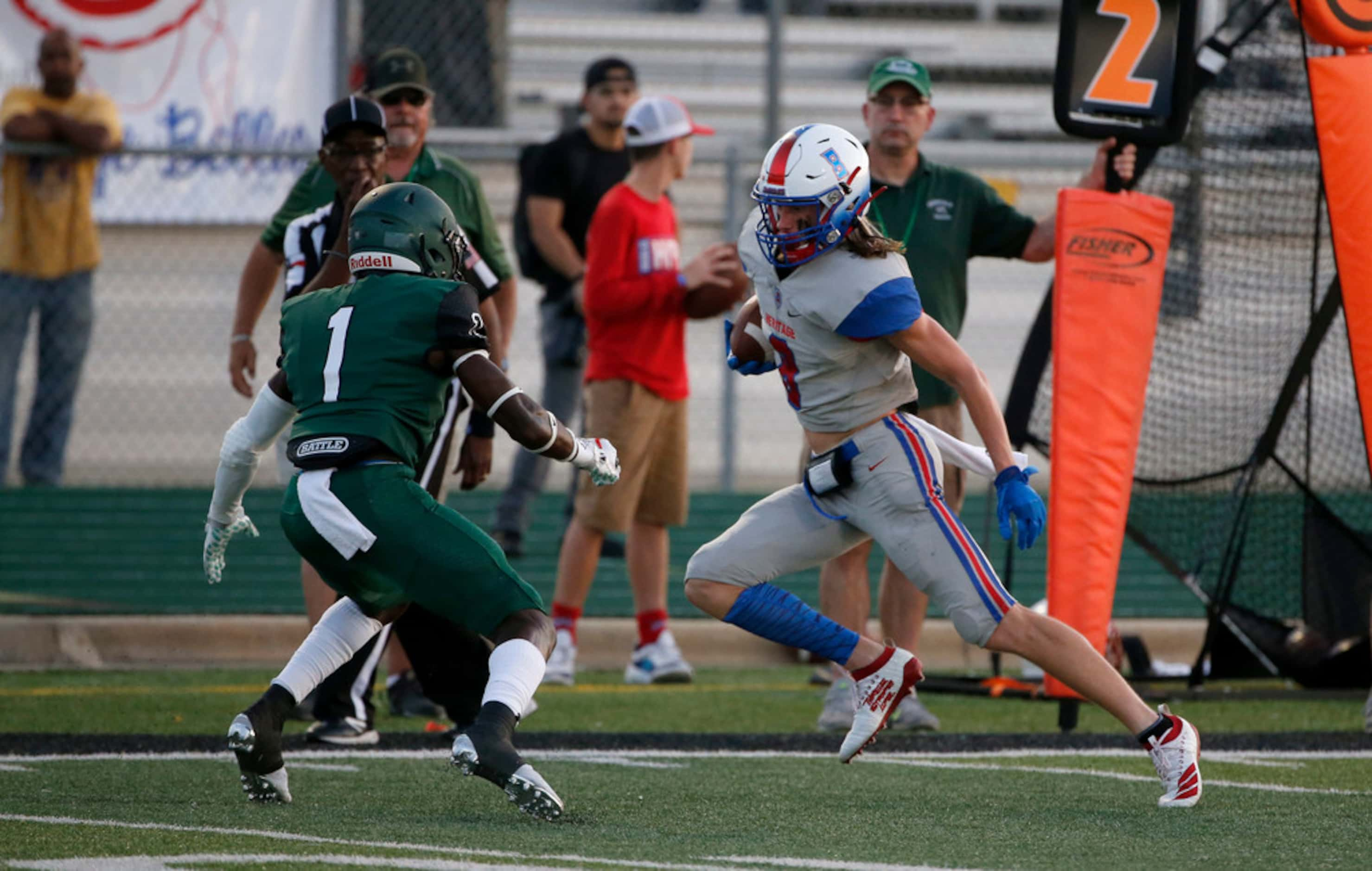 Midlothian Heritage receiver Jay Wilkerson (8) tries to get past Kennedale defender Elijah...