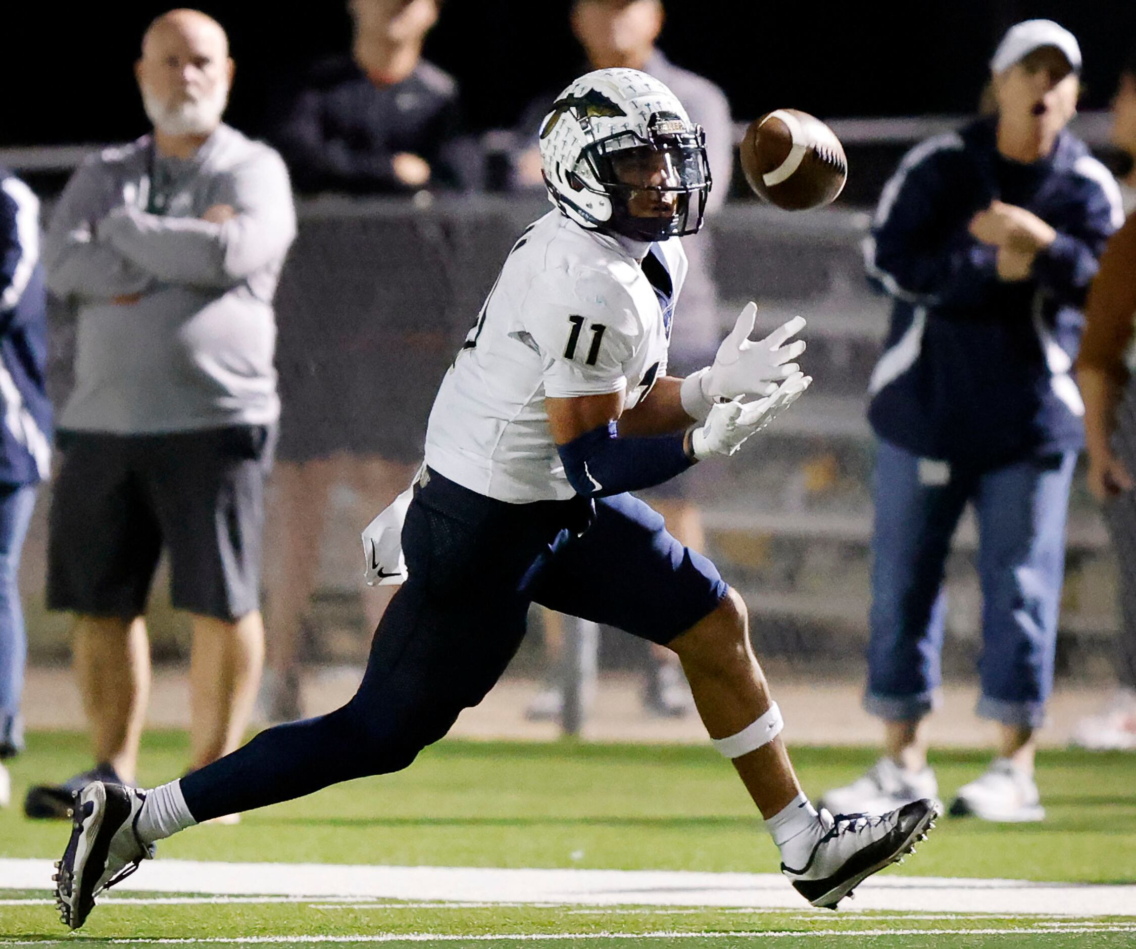 Keller wide receiver Amarion Henry (11) pulls in a pass along the sideline during the fourth...