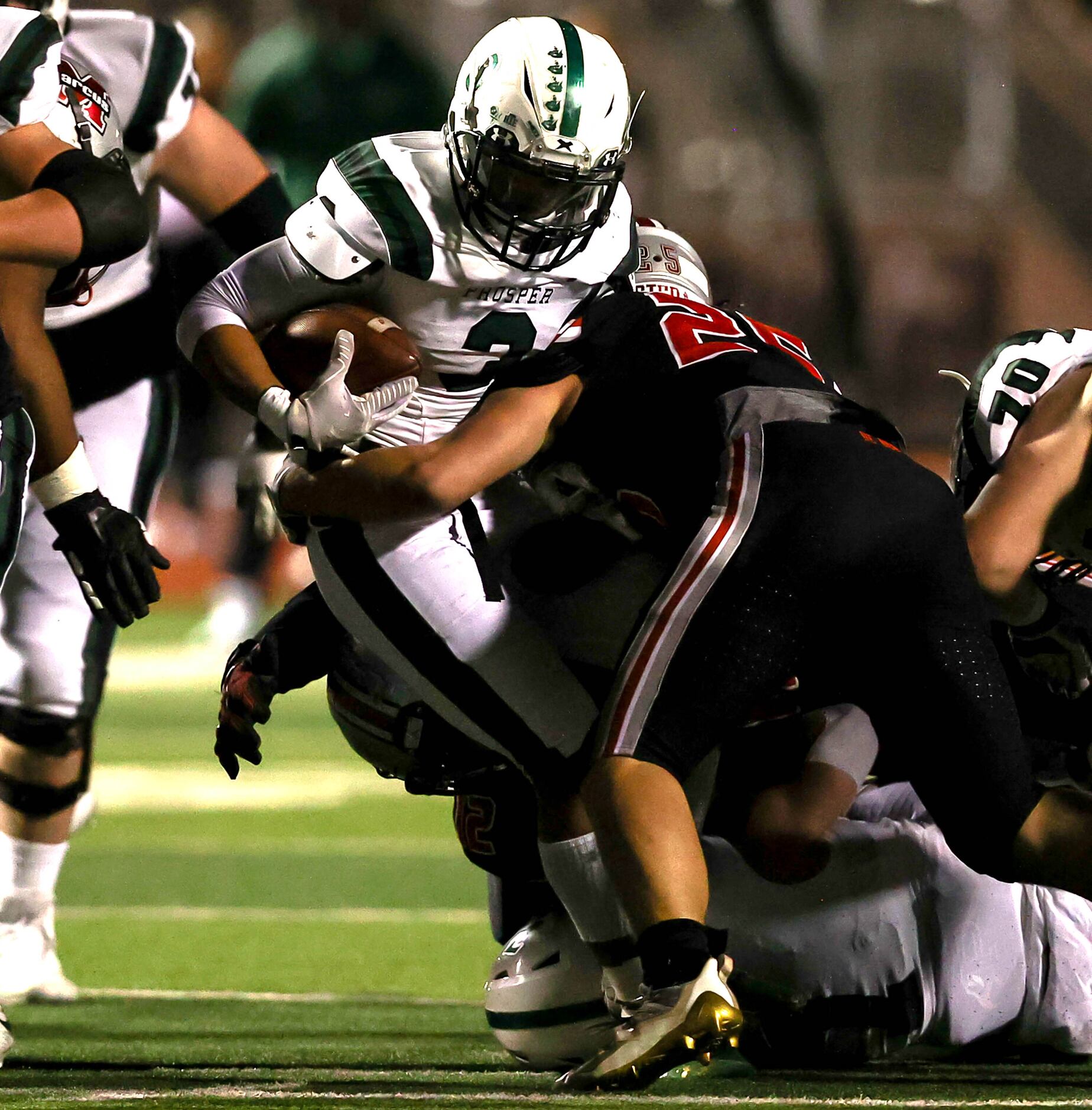 Prosper running back Malik Dailey (3) is stopped for a short gain by Flower Mound Marcus...