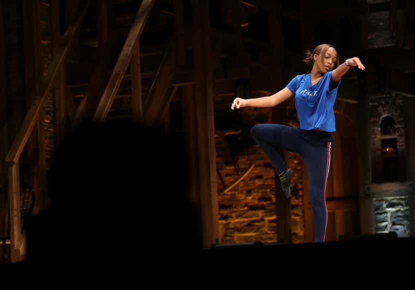 A Booker T. Washington student performs an interpretive dance during a Hamilton Education...