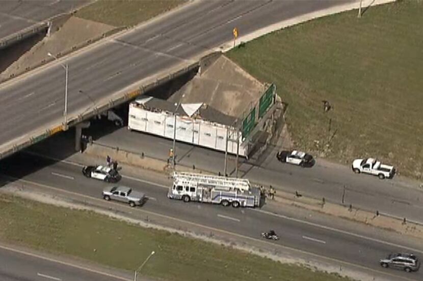 A modular home in tow behind a truck struck a freeway overpass Wednesday in Fort Worth.