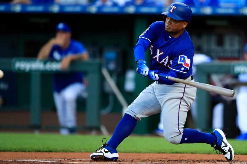 Texas Rangers designated hitter Willie Calhoun hits a two-run home run off Kansas City...