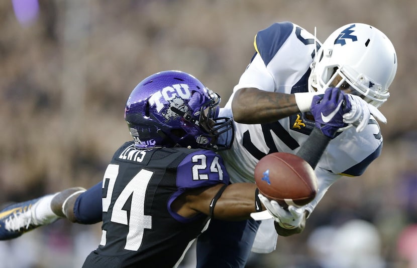 TCU Horned Frogs cornerback Julius Lewis (24) knocks the ball away from West Virginia...