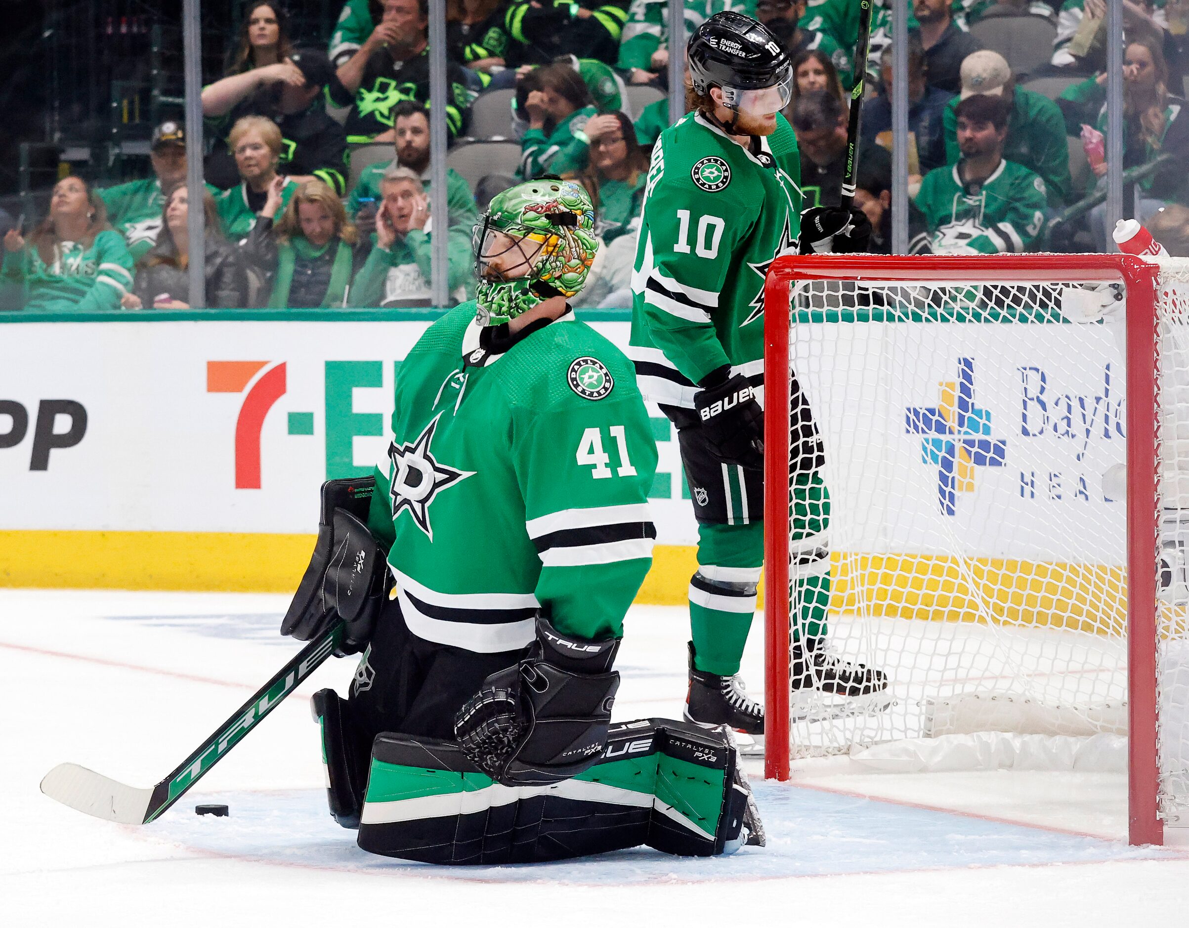 Dallas Stars goaltender Scott Wedgewood (41) kneels in the crease after being scored on by...