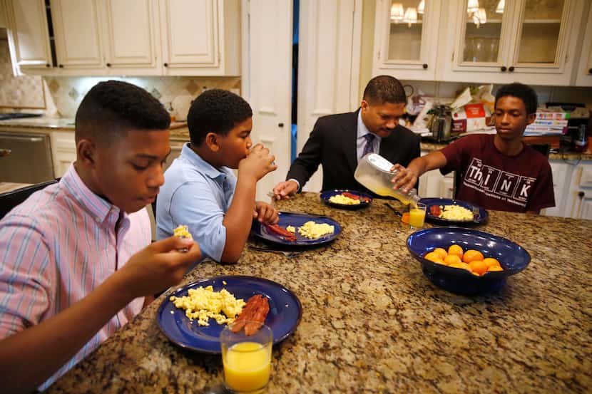 From left, William Waters, Christopher Waters, James Waters and Joshua Waters eat breakfast...