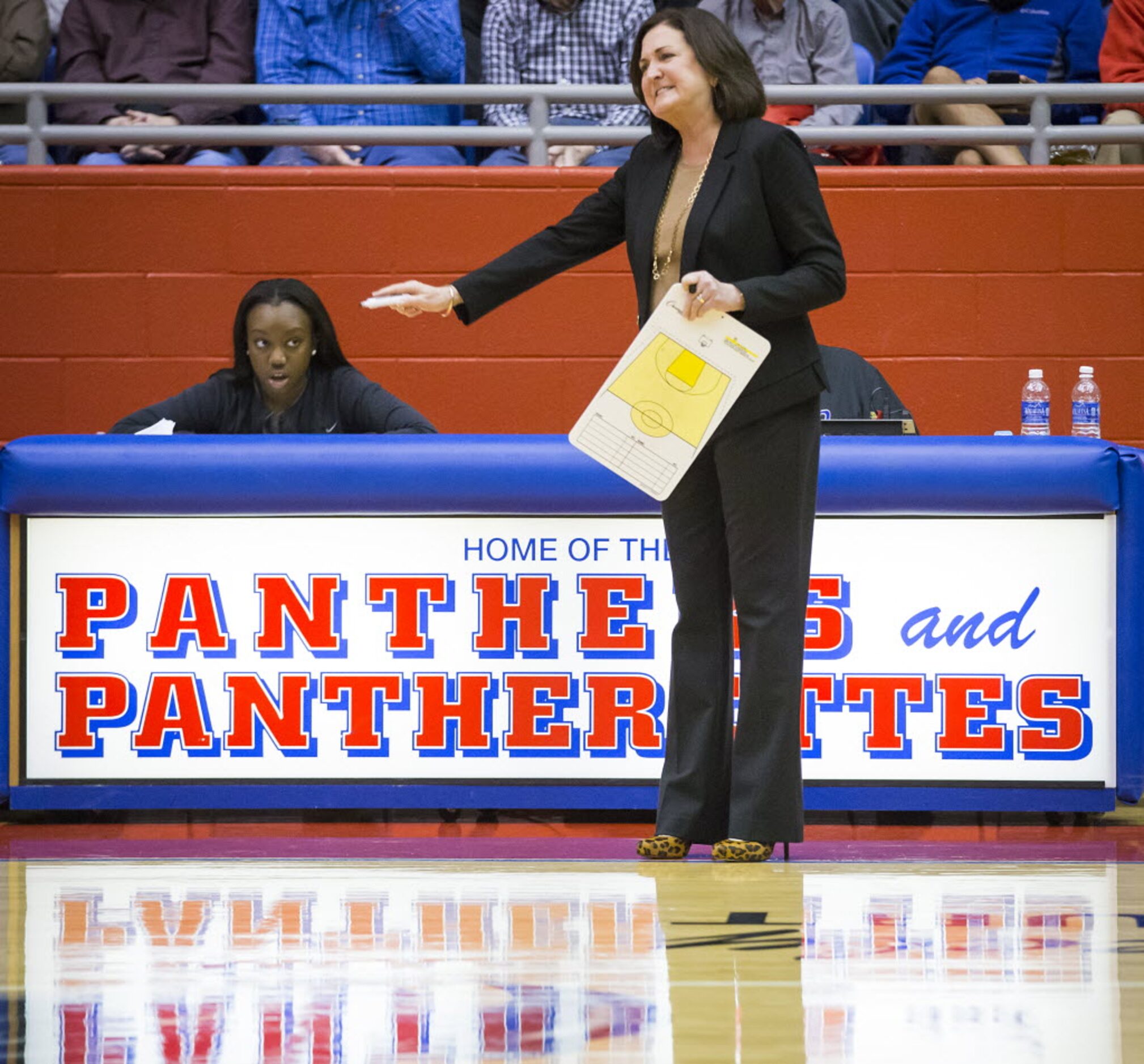 Duncanville head coach Cathy Self-Morgan motions to her players during the second half of a...