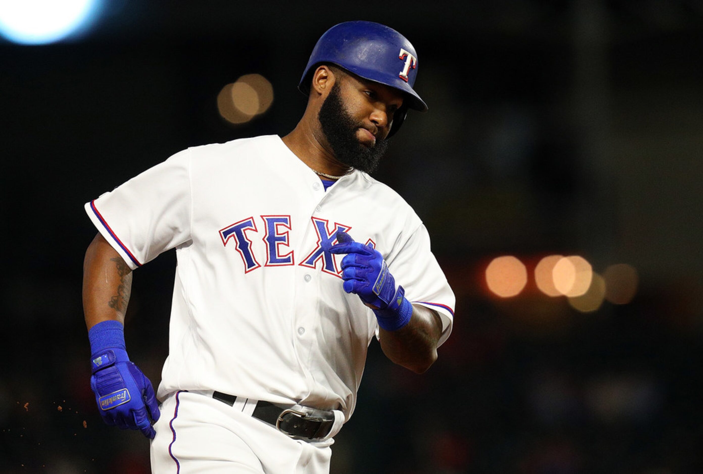 ARLINGTON, TEXAS - AUGUST 30: Danny Santana #38 of the Texas Rangers rounds third base after...