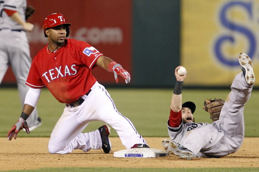 Texas Rangers shortstop Elvis Andrus (1) safely steals second base as Boston Red Sox second...
