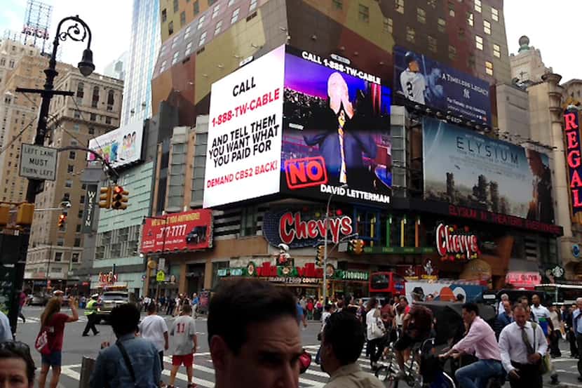This image provided by CBS shows a CBS advertisement in Times Square in New York on Friday,...