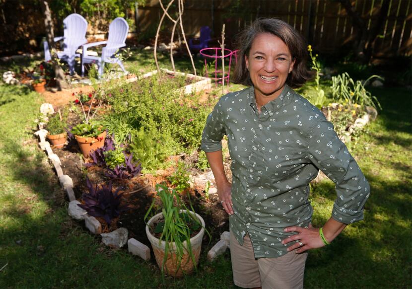 Shelley Cramm in her garden at her home in Irving.