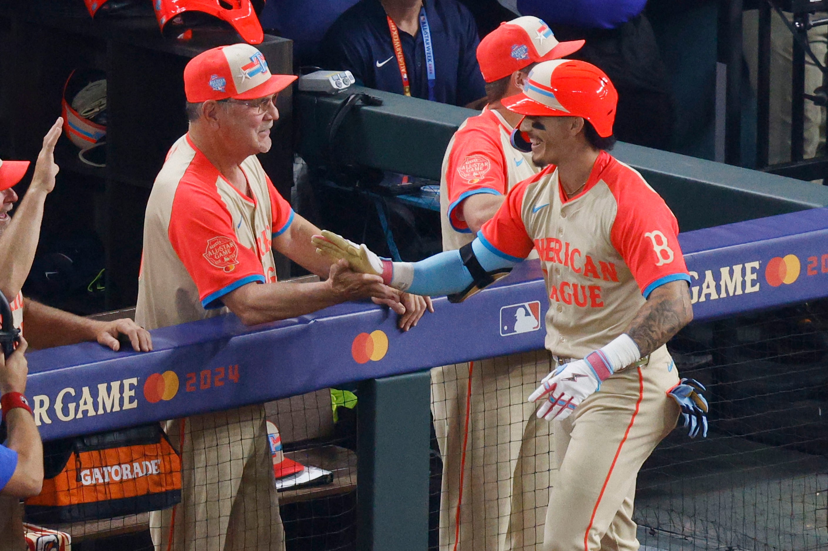 American League's Jarren Duran of Boston Red Sox (16), right, gets a high-five from American...