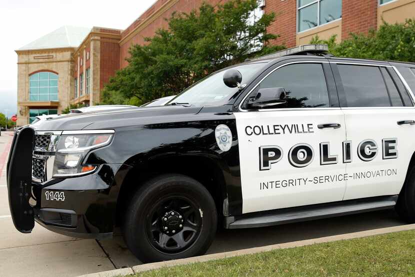 A Colleyville Police vehicle is parked at a local fitness center in Colleyville, Texas,...