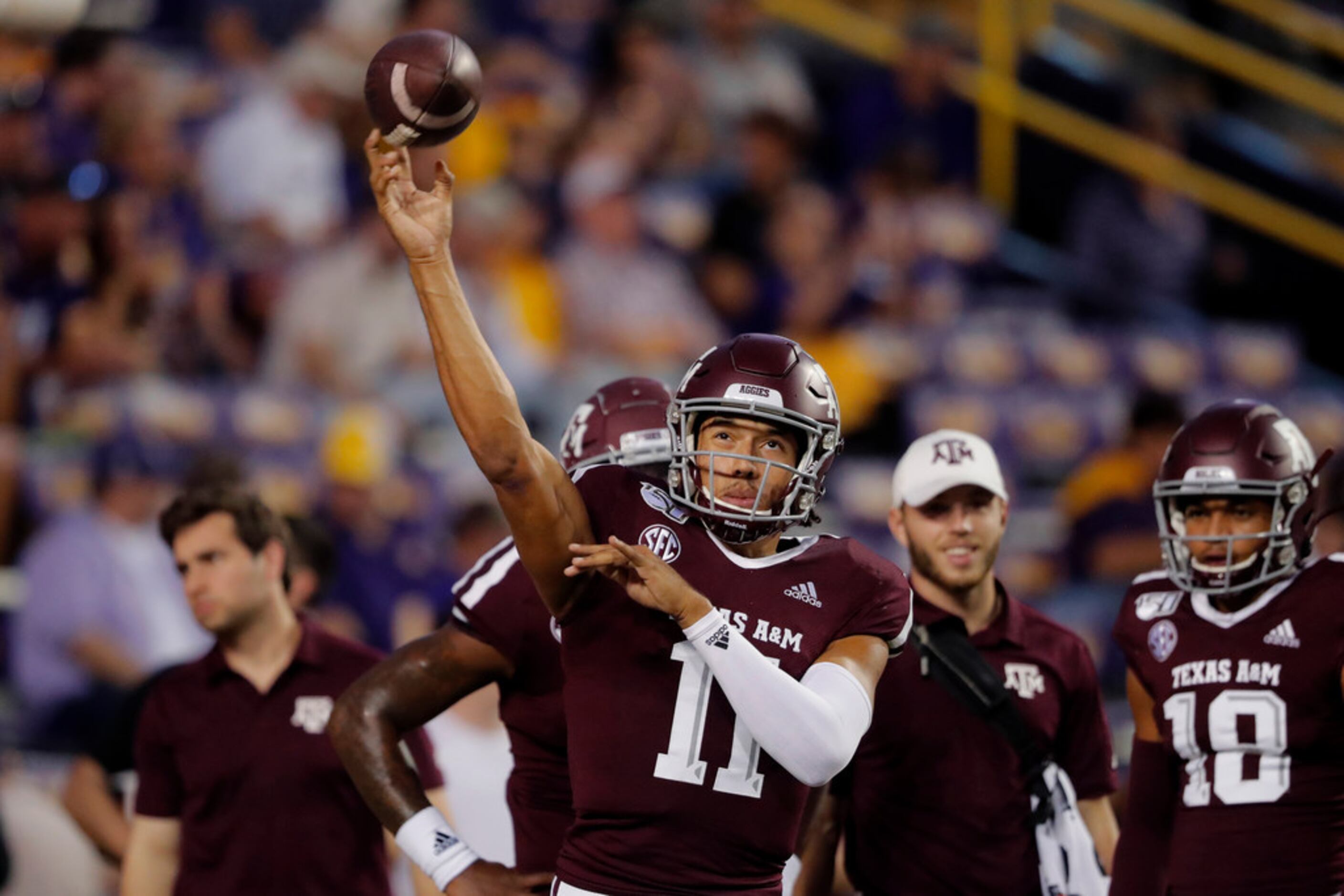 Texas A&M quarterback Kellen Mond (11) warms up before an NCAA college football game against...