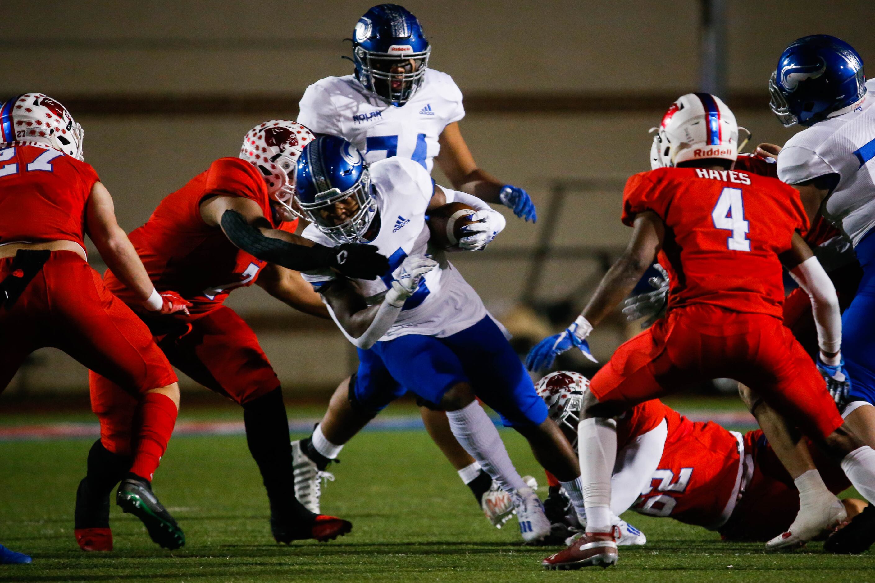 Fort Worth Nolan's Kennon Polk (5) is tackled during the first half of a TAPPS Division I...