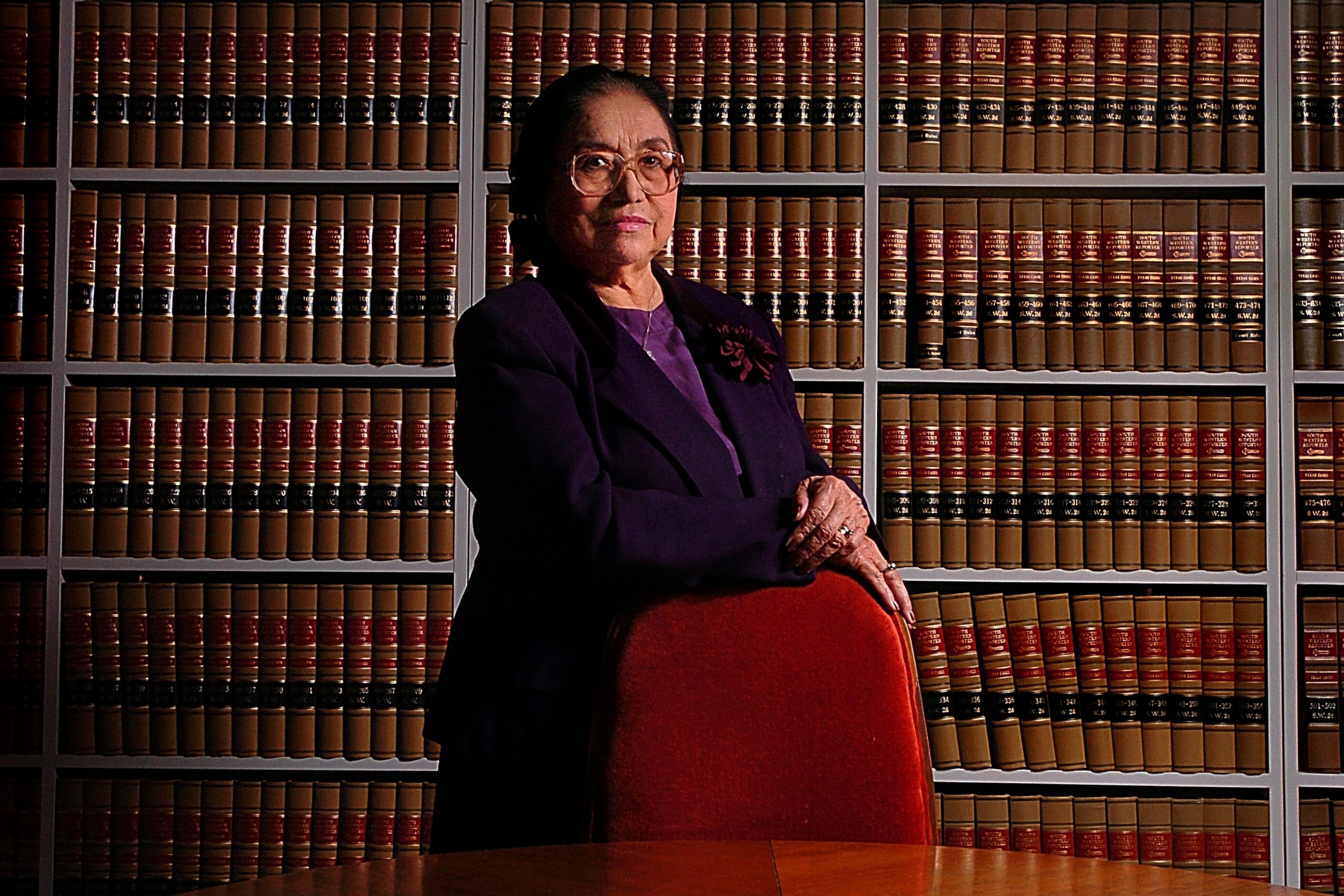 Adelfa Callejo poses for a photo in her office library on Dec. 17, 2003, in Dallas. She was...